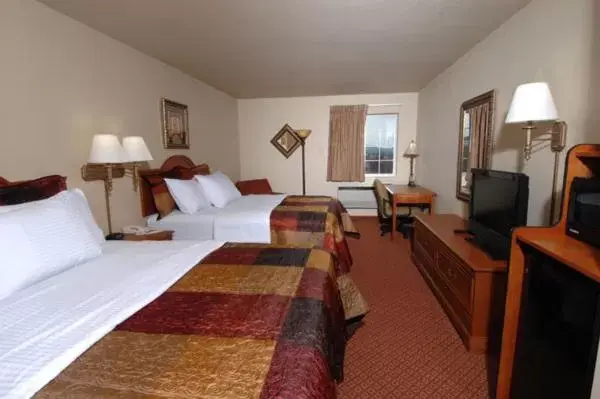 Bed in All American Inn & Suites Branson Bed in All American Inn & Suites Branson