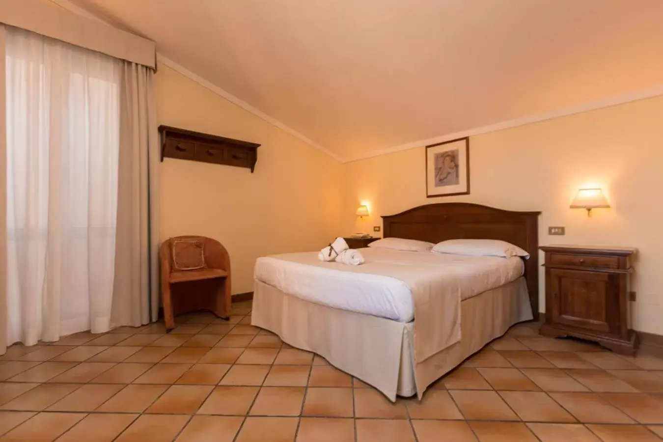 Bed in Hotel Le Mura