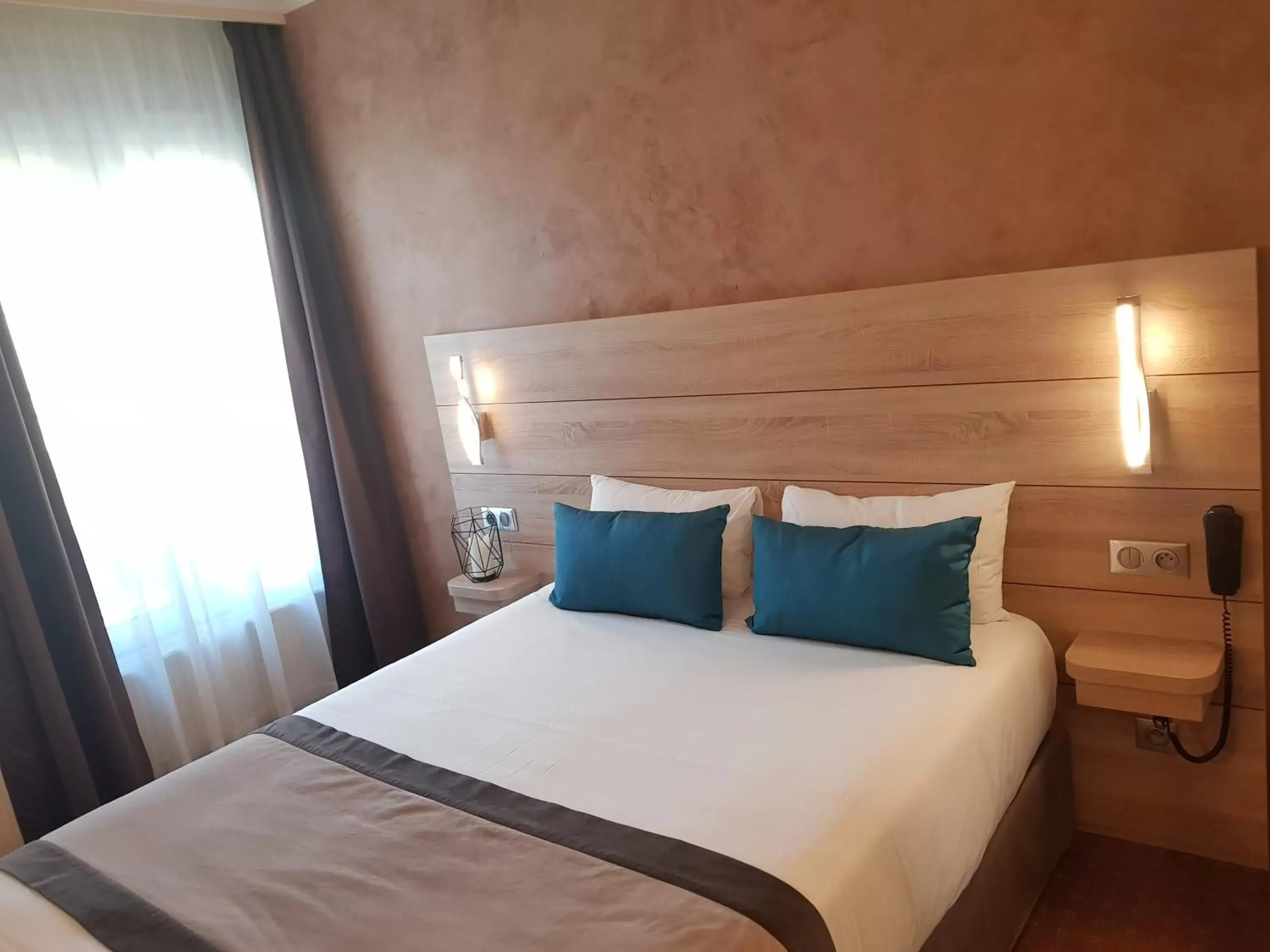 Bed in Hotel Champerret Elysees