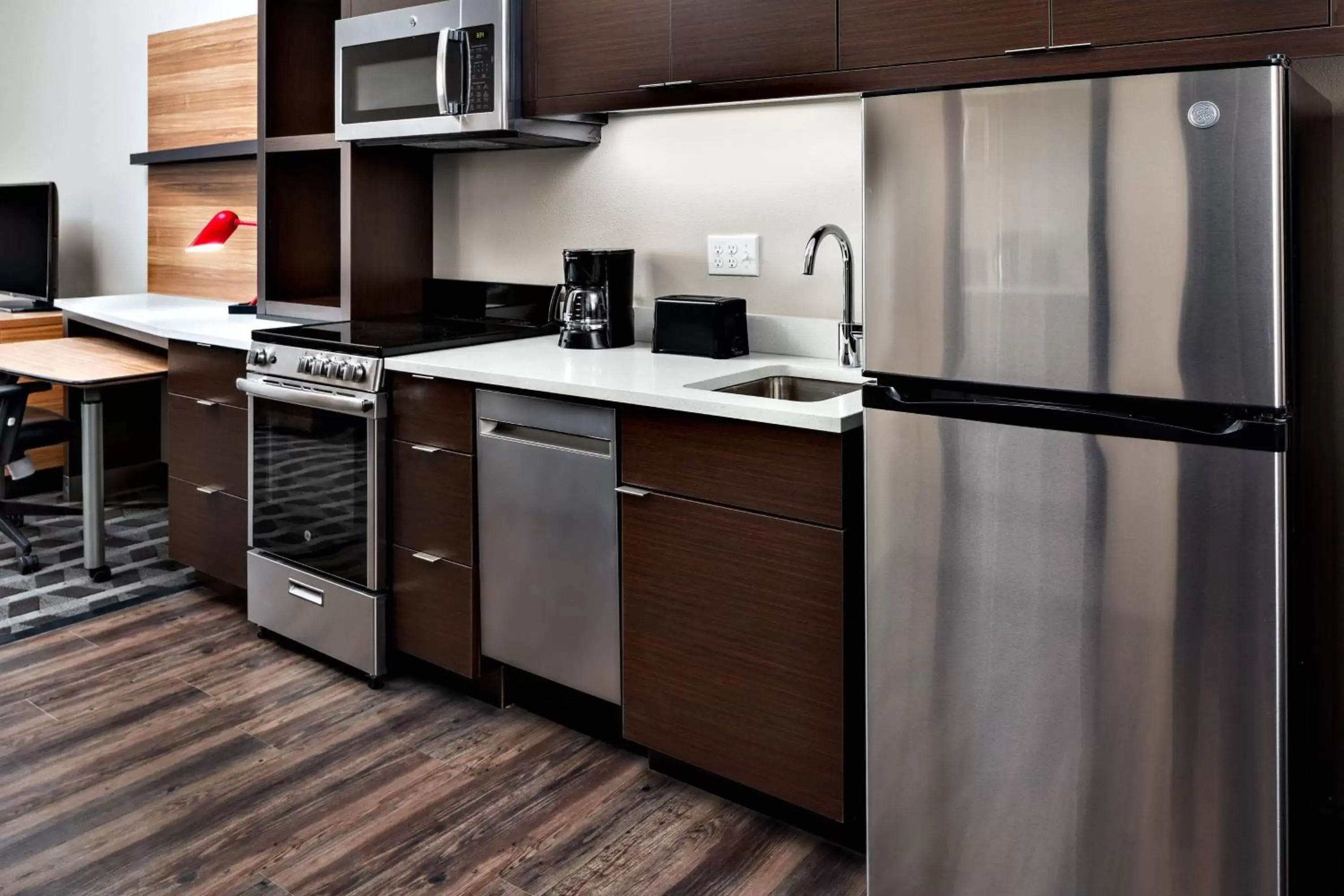 Bedroom, Kitchen/Kitchenette in TownePlace Suites by Marriott Loveland Fort Collins