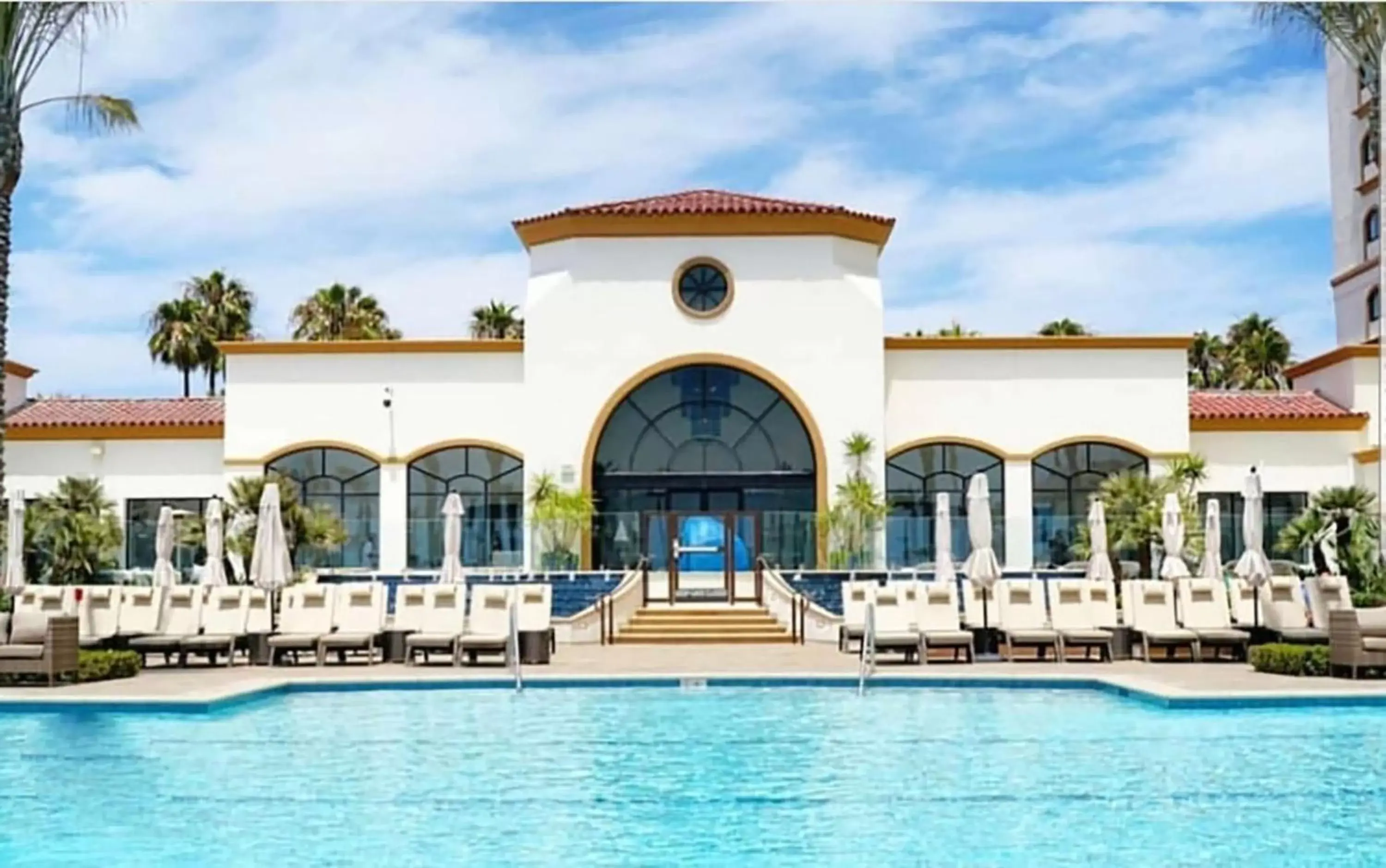 Pool view in The Waterfront Beach Resort, A Hilton Hotel Pool view in The Waterfront Beach Resort, A Hilton Hotel