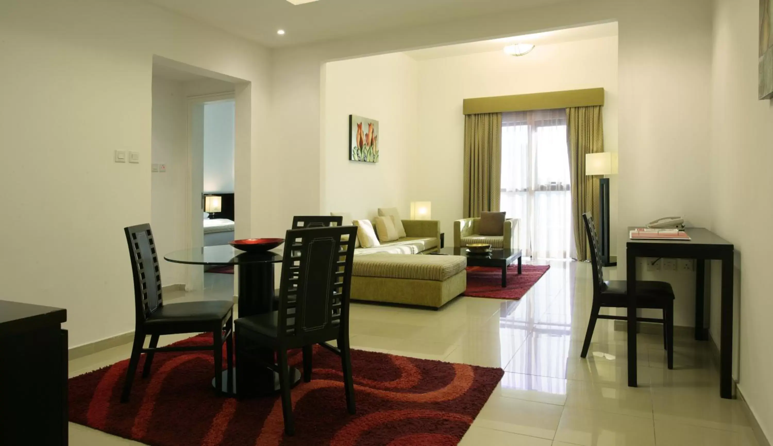 Living room, Dining Area in Ramada Hotel & Suites by Wyndham Ajman