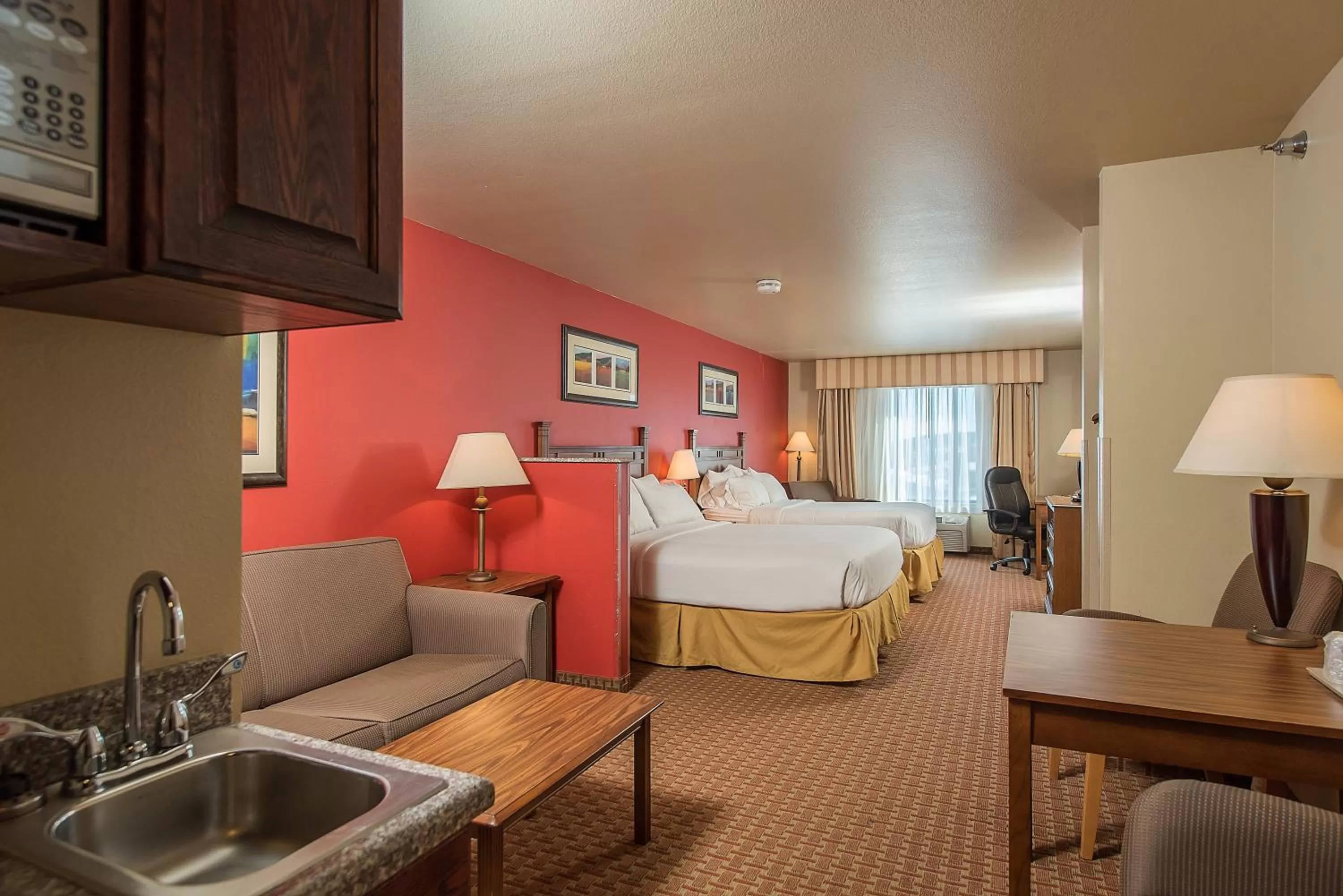 Bed in Baymont Inn & Suites by Wyndham Sturgis