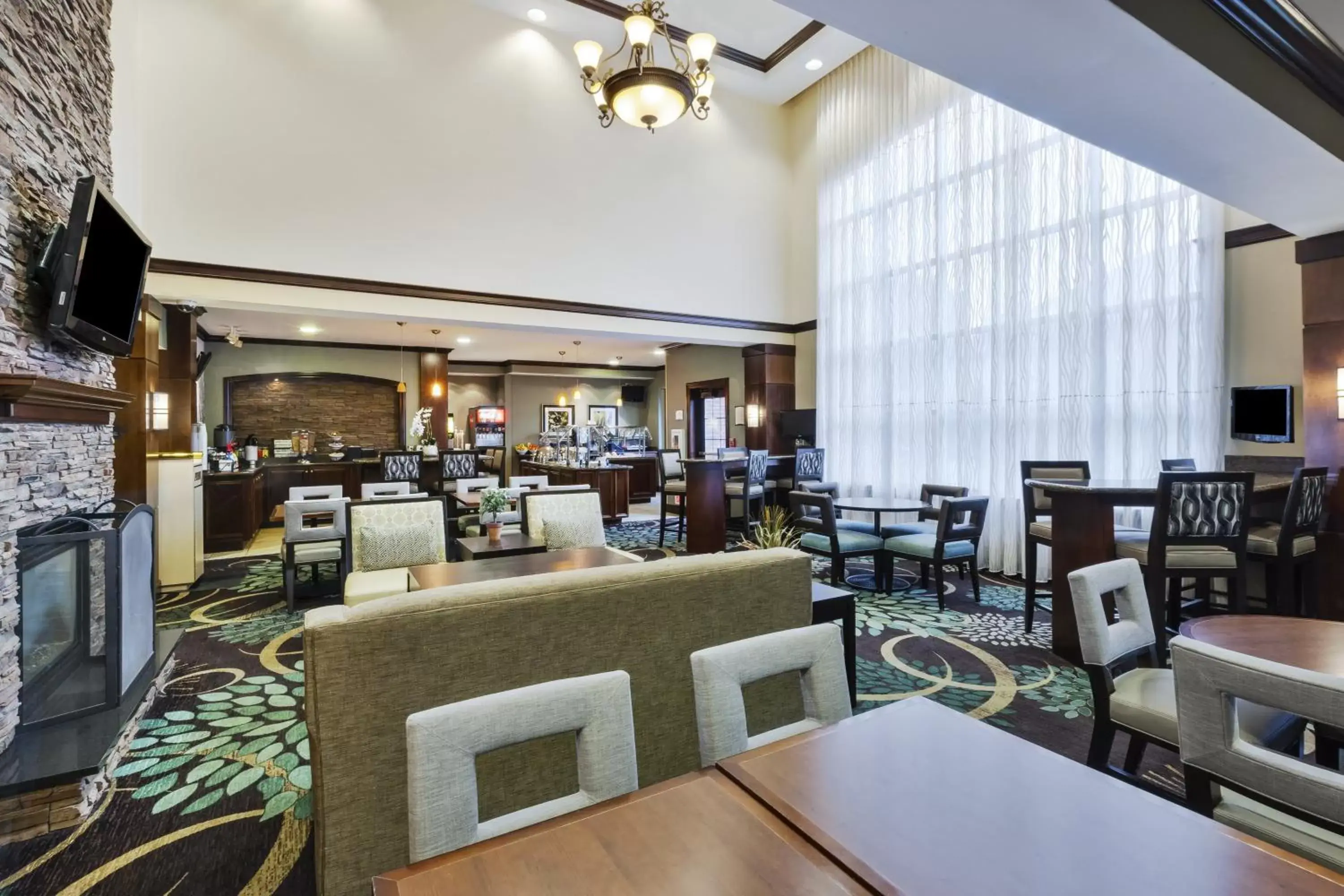 Lobby or reception, Restaurant/Places to Eat in Staybridge Suites Lansing-Okemos, an IHG Hotel