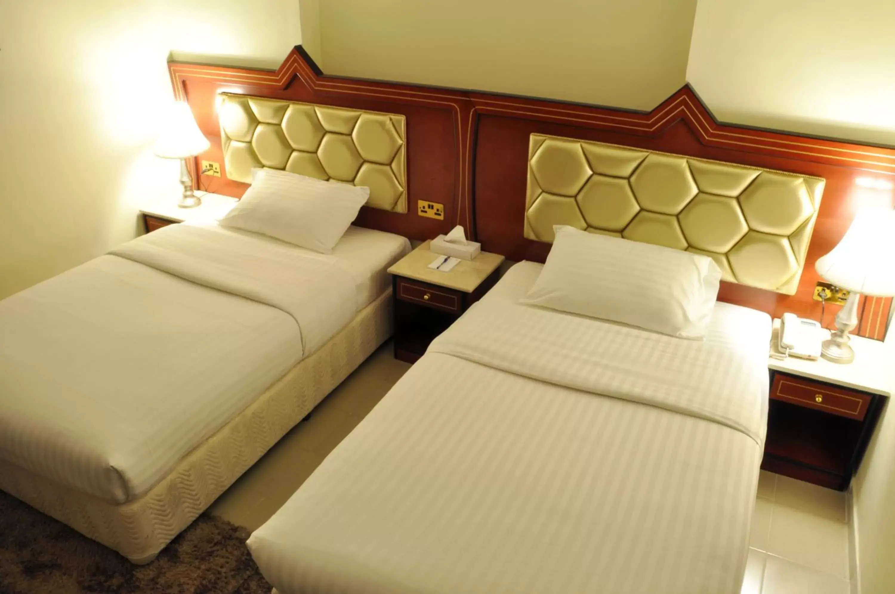 Bed in Saffron Hotel