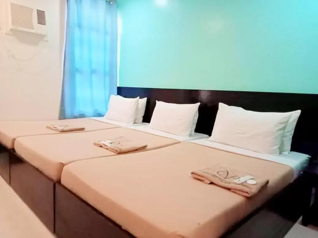 Bed in Coron Visitors Hotel