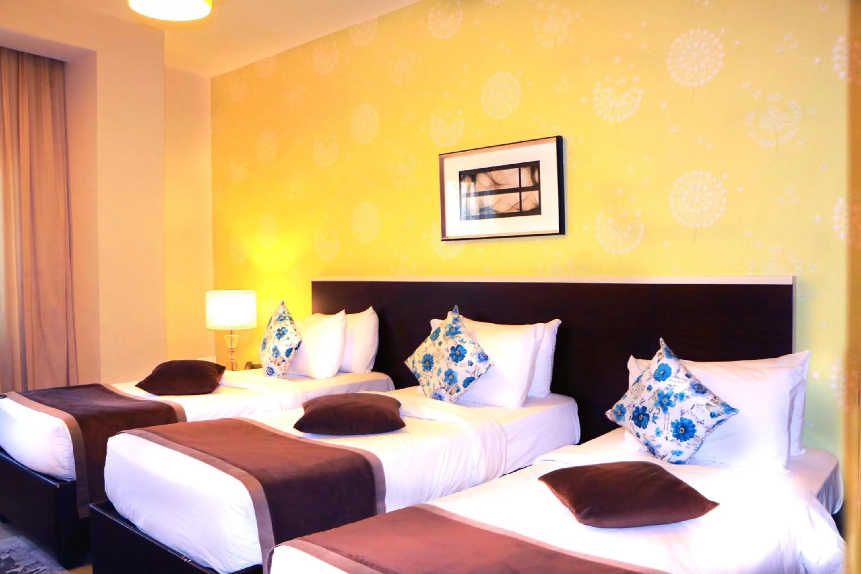 Bed in City Rose Hotel Suites