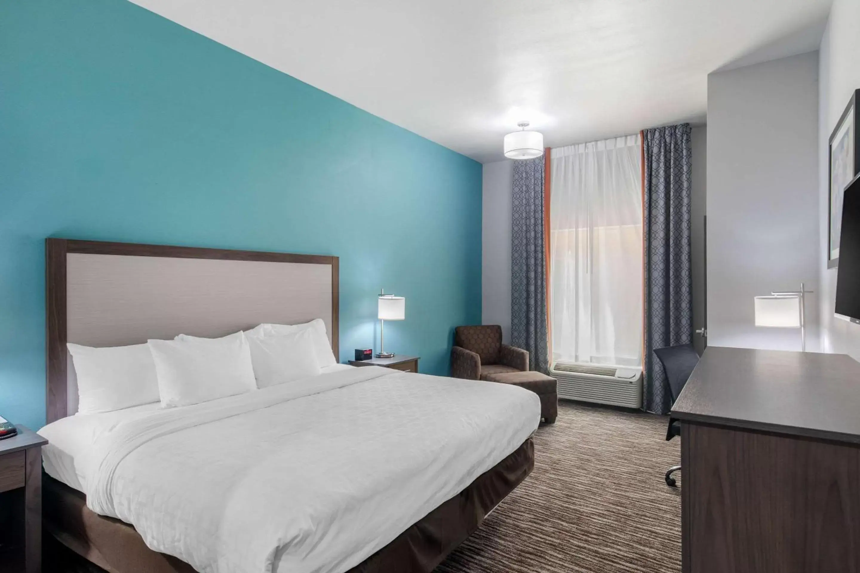 Photo of the whole room, Bed in Clarion Inn & Suites DFW North