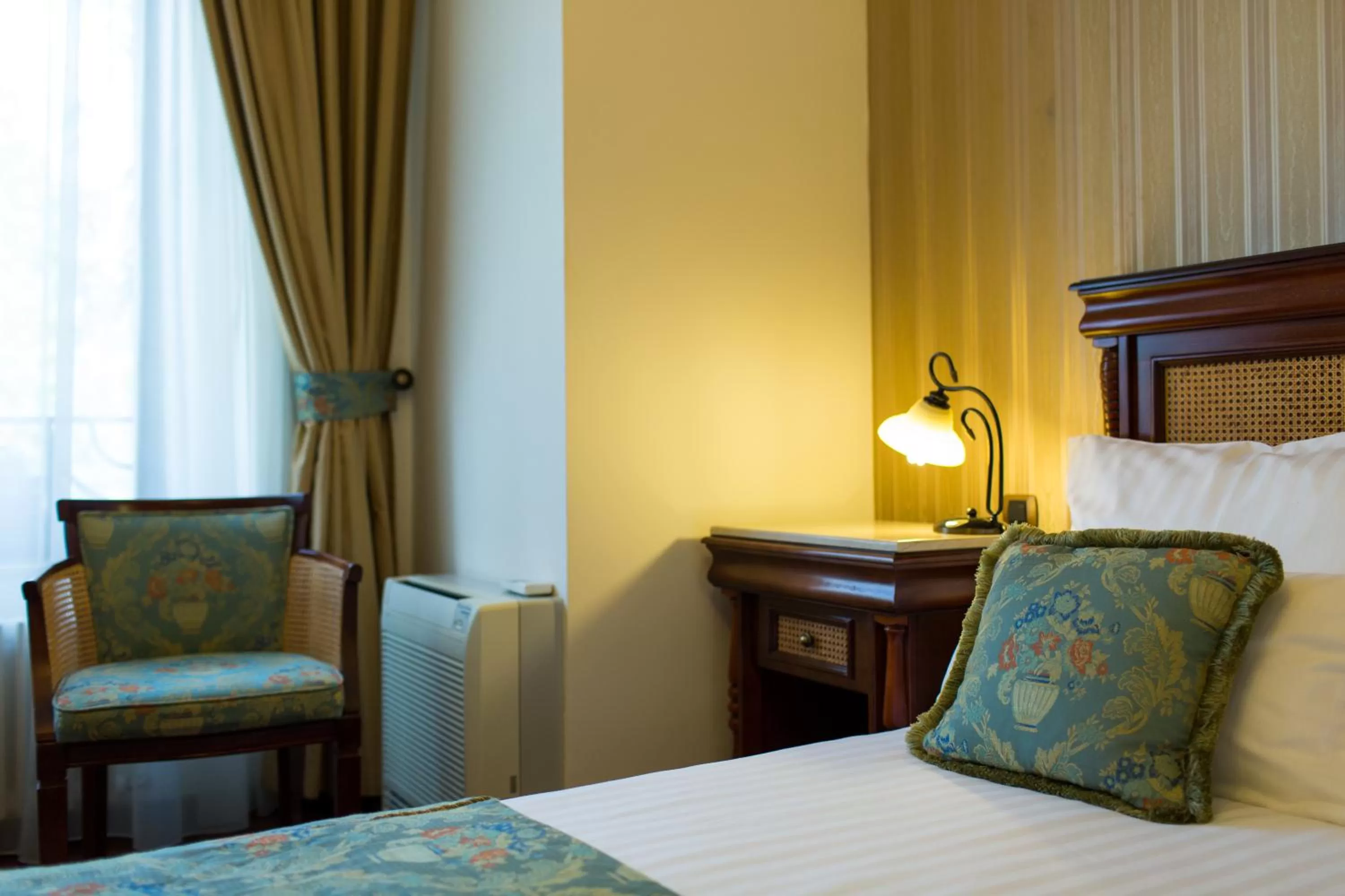 Bed in Vila Paris Boutique Hotel