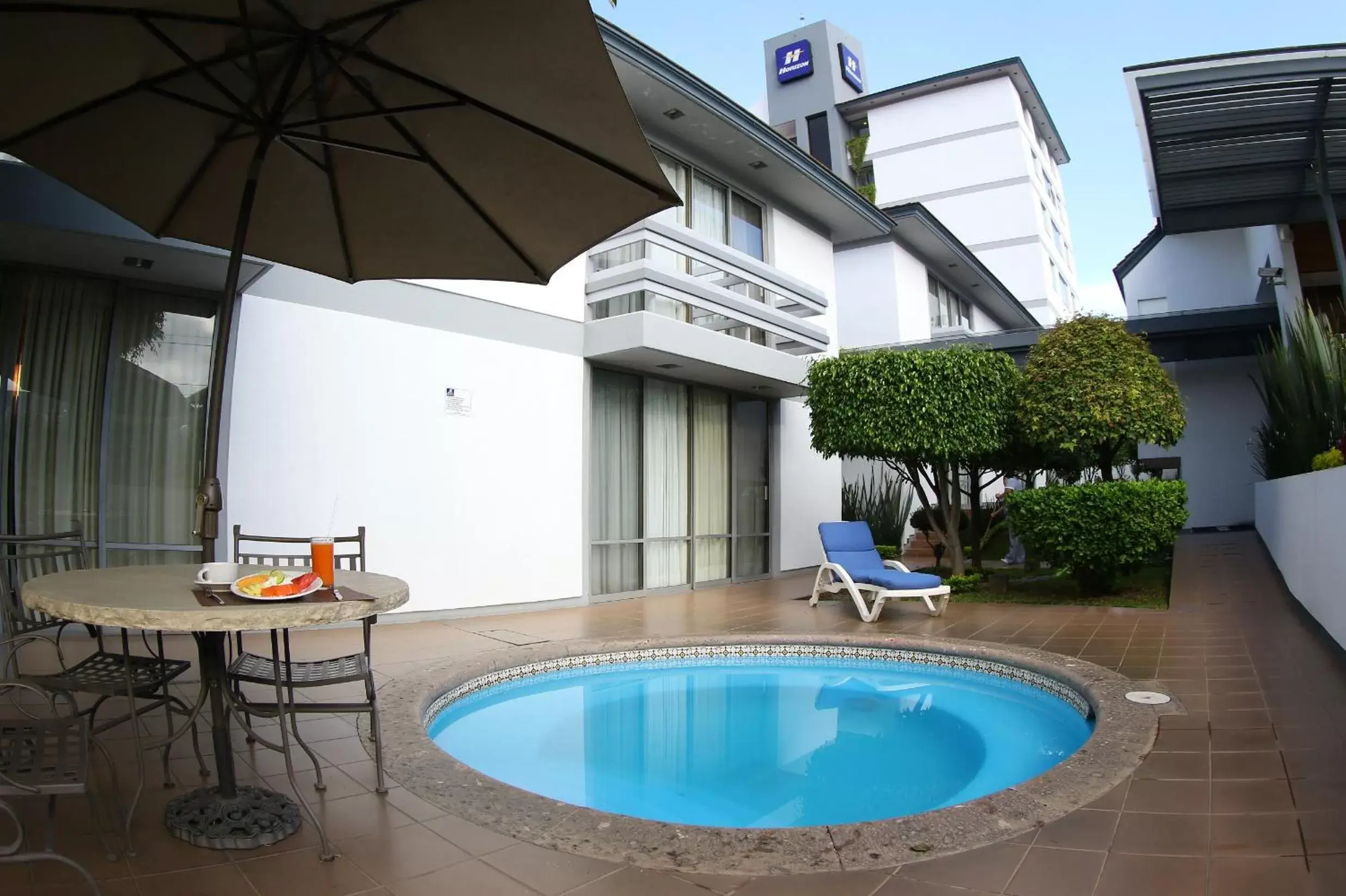 Garden, Swimming Pool in Hotel Horizon & Convention Center