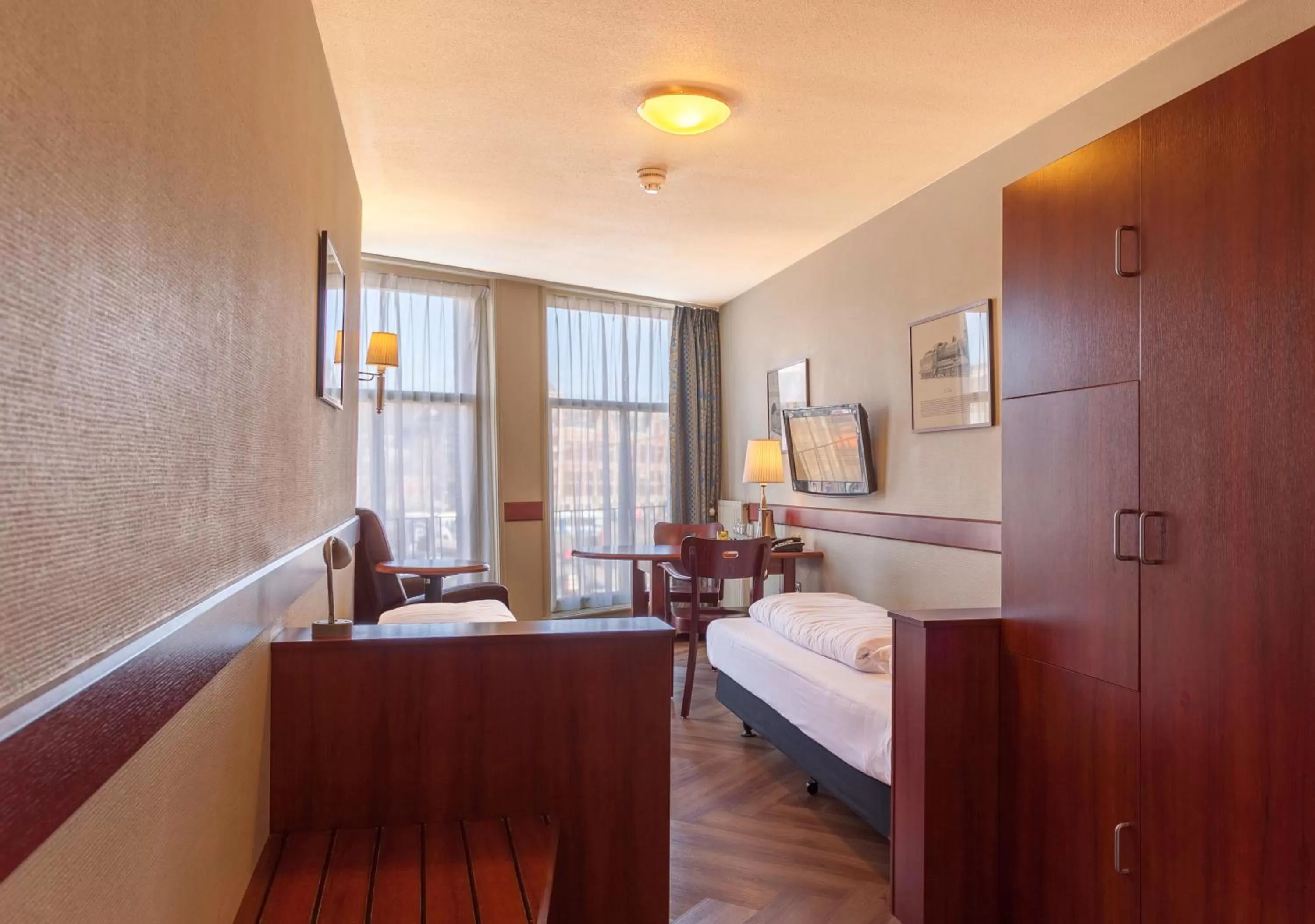 Seating area, Bed in A-Train Hotel