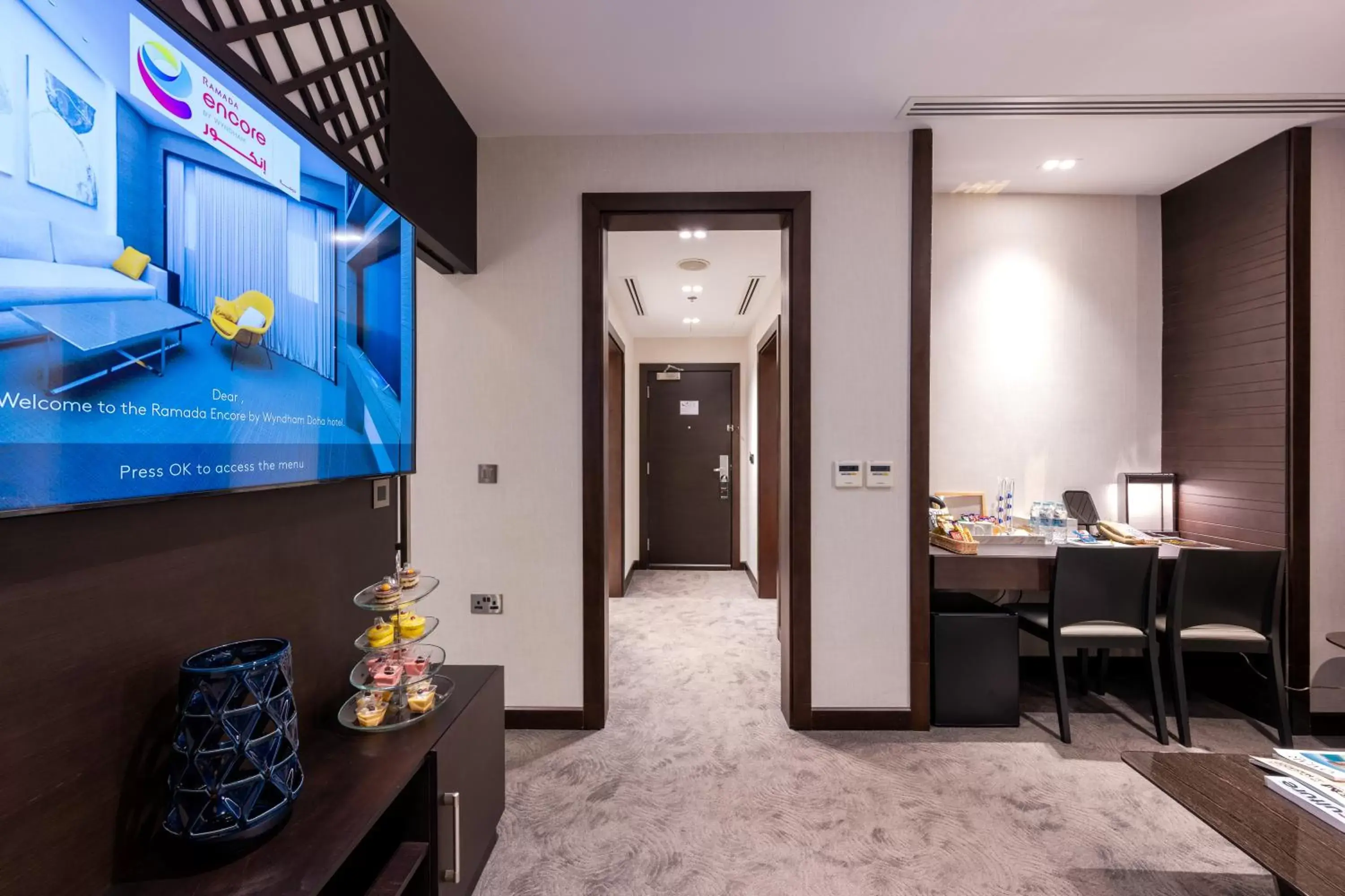 Photo of the whole room, TV/Entertainment Center in Ramada Encore Doha by Wyndham