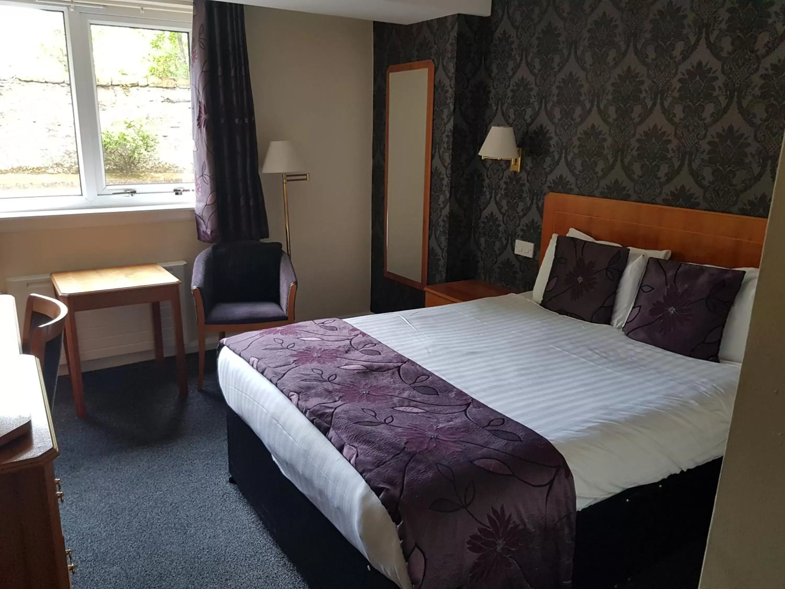 Bed in The Tontine Hotel Bed in The Tontine Hotel