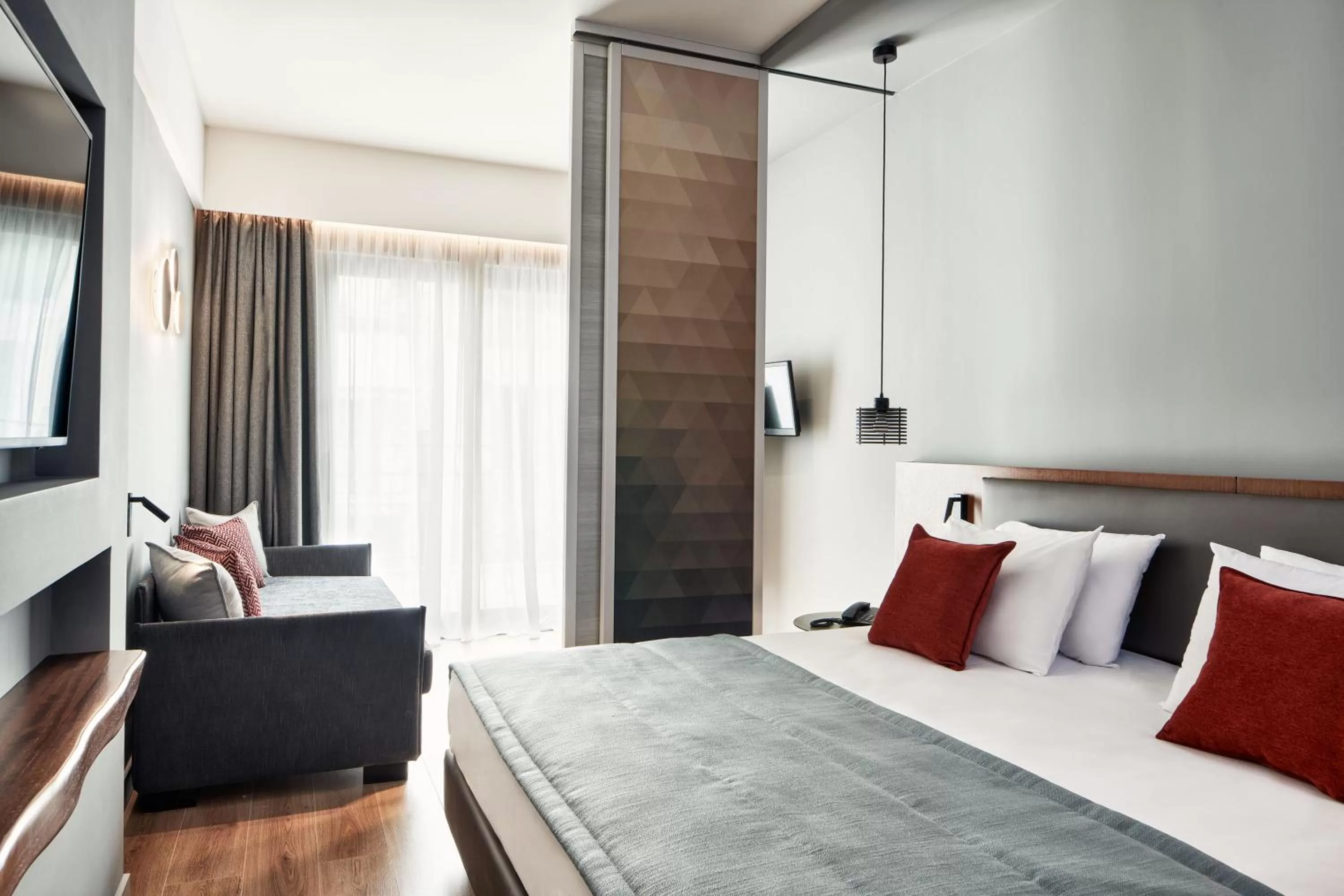 Bed in Hotel Achilleas