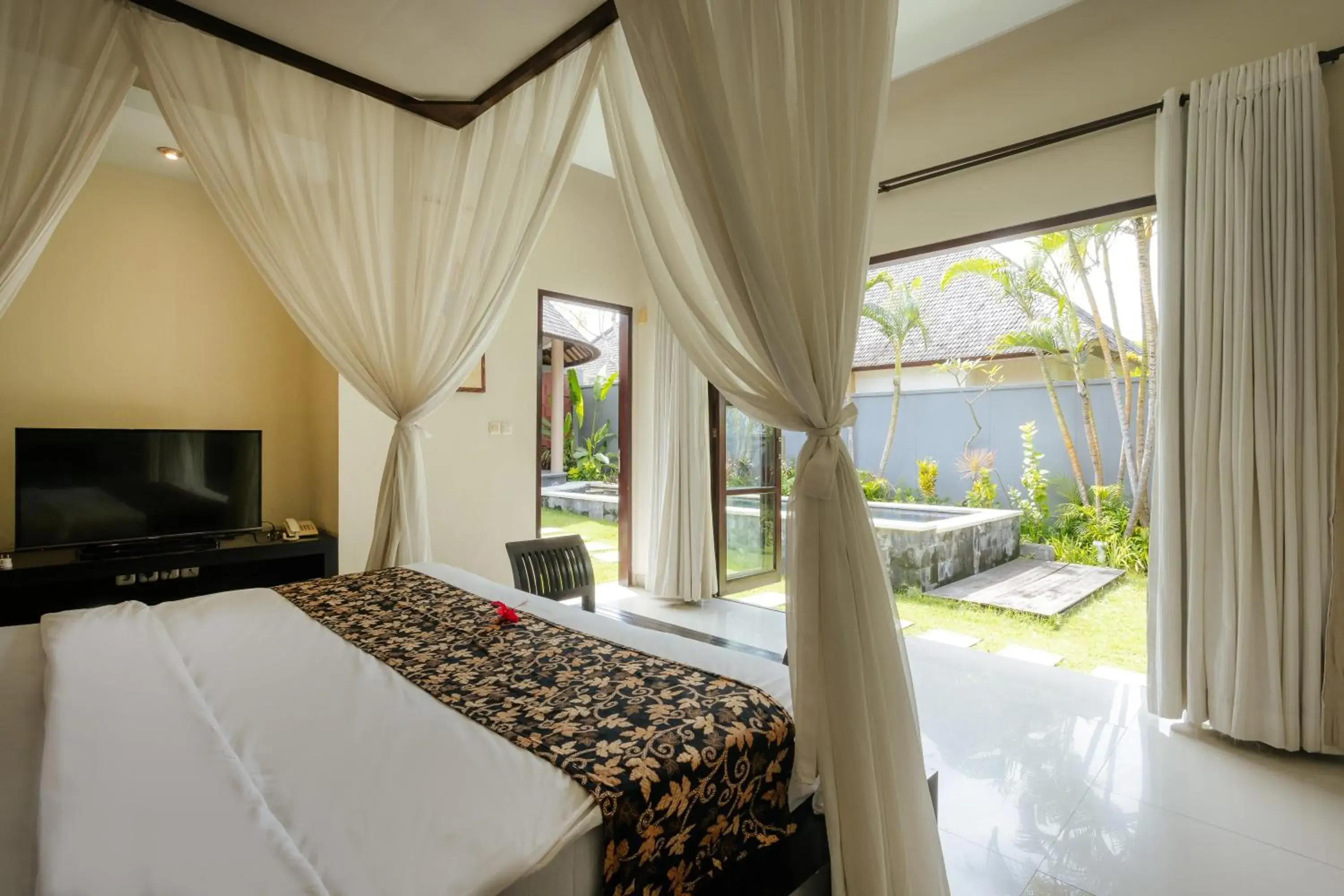 Bed in The Bidadari Villas and Spa