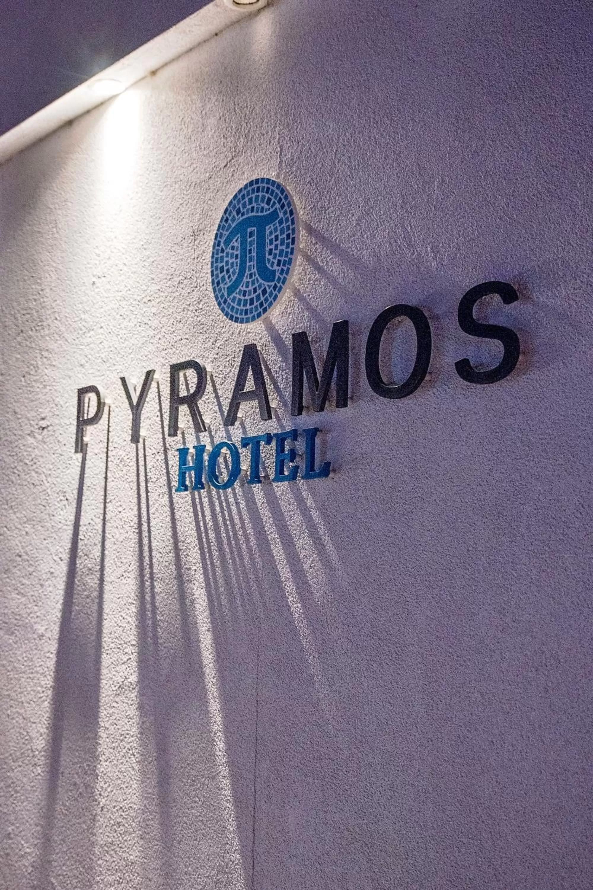 Property logo or sign in Pyramos Hotel