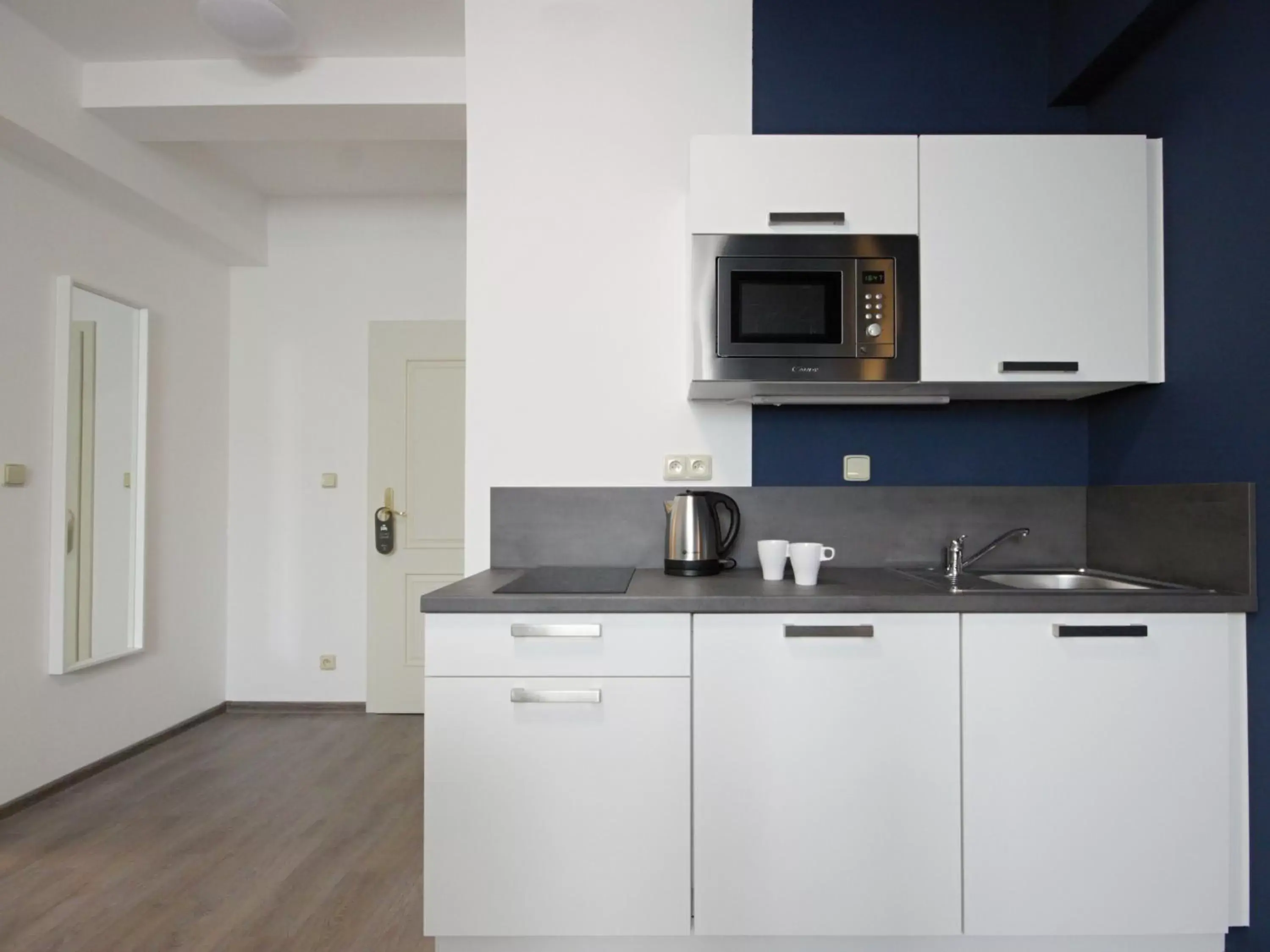 Kitchen or kitchenette in Alveo Suites