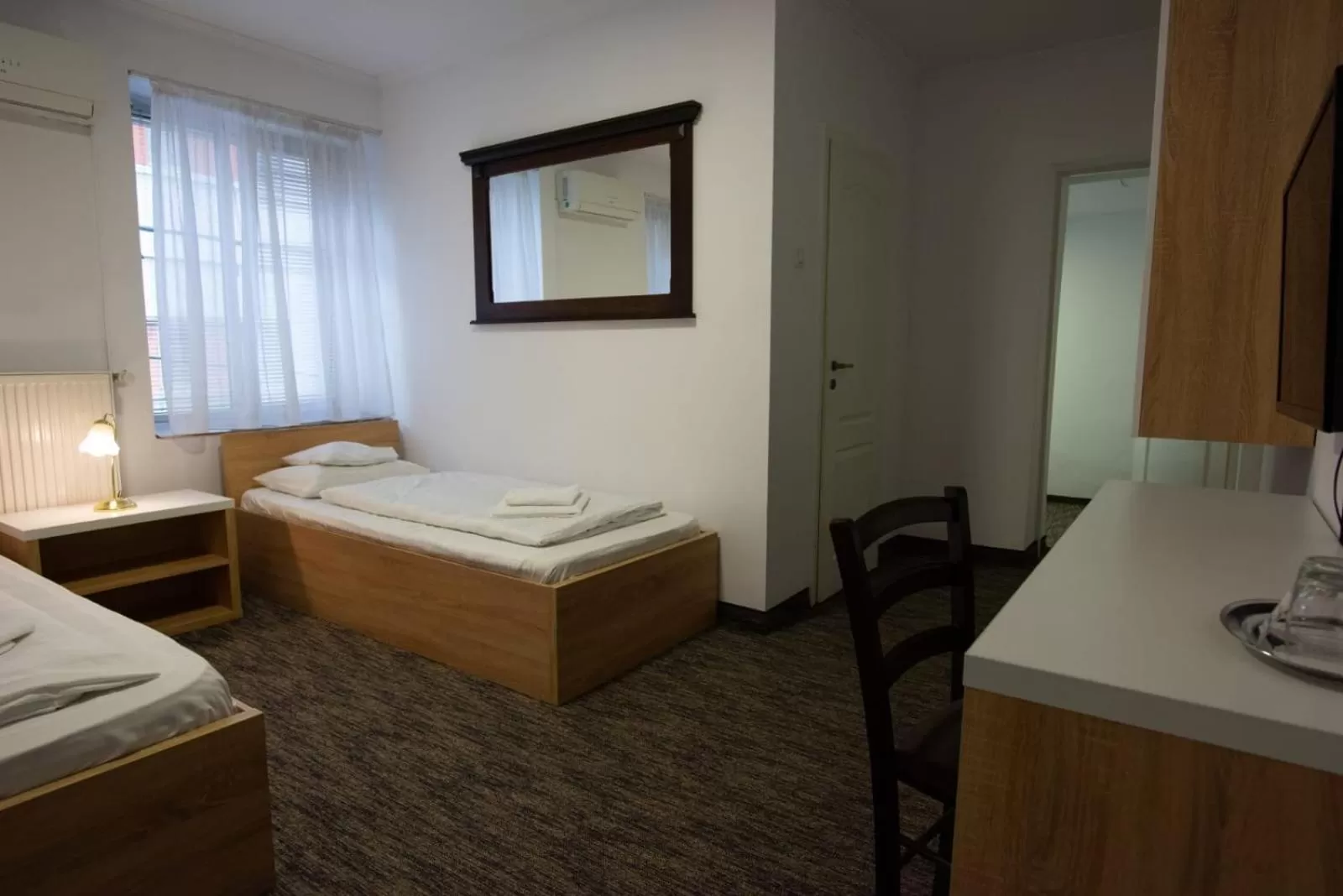 Bed in Carnival City Hotel Oradea