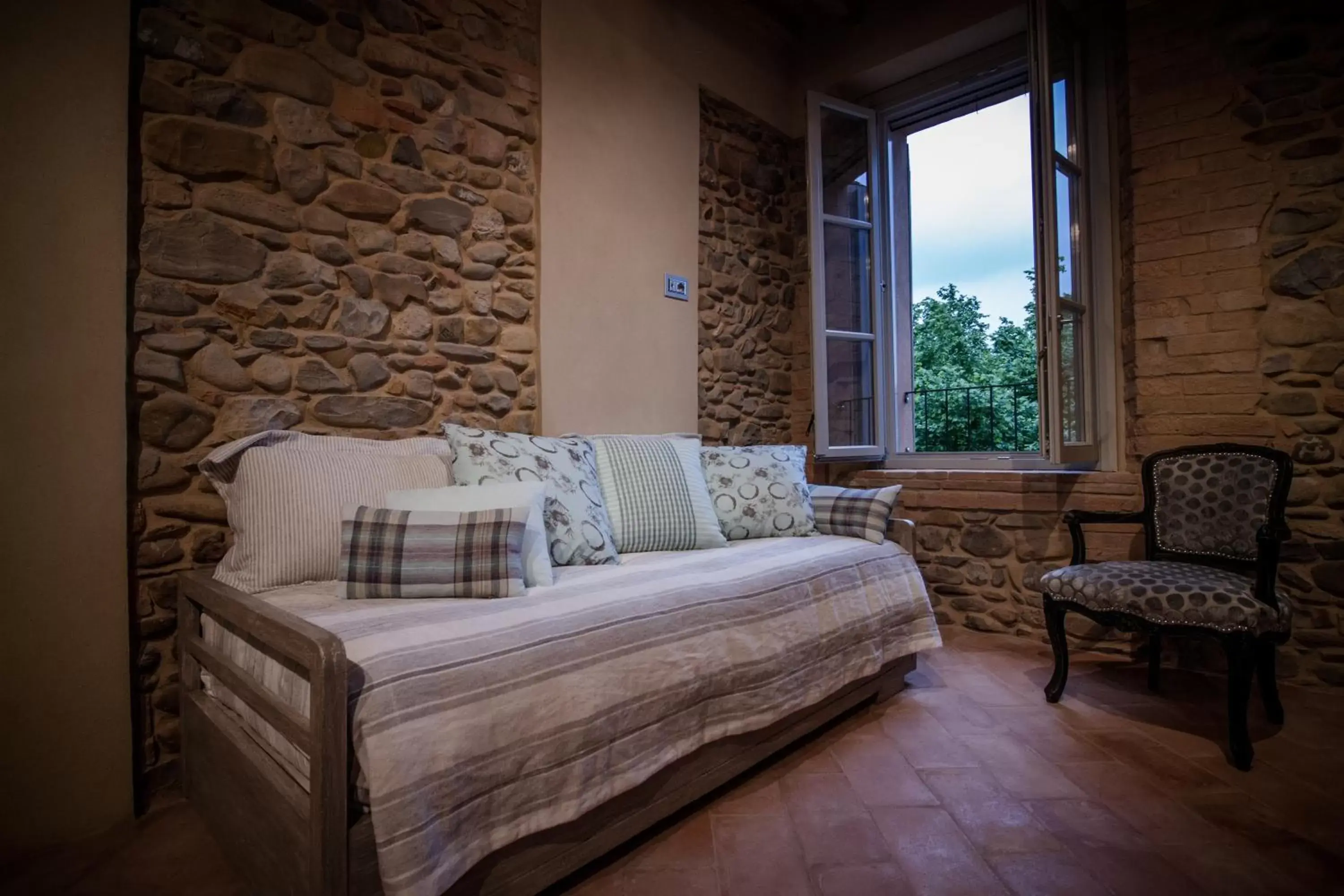 Bed, Seating Area in Corte Finzi