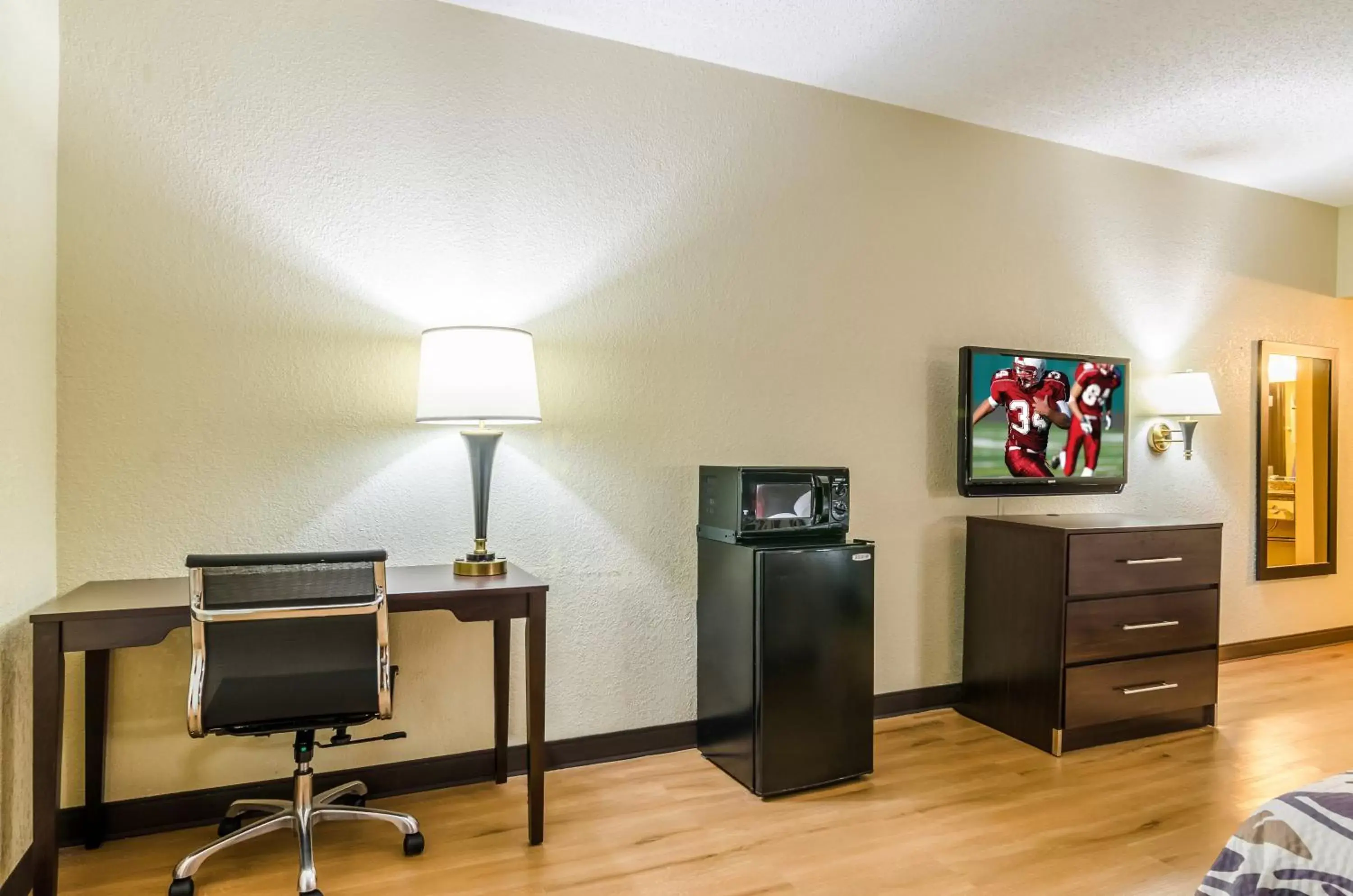 Photo of the whole room, TV/Entertainment Center in Red Roof Inn & Conference Center Wichita Airport