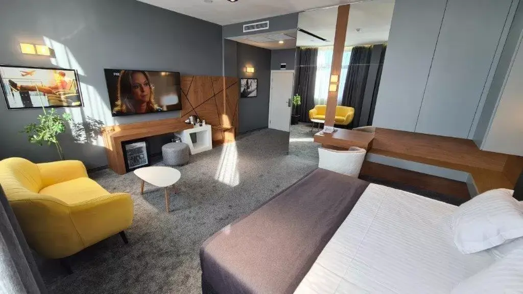 Communal lounge/ TV room in Aqua Hotel