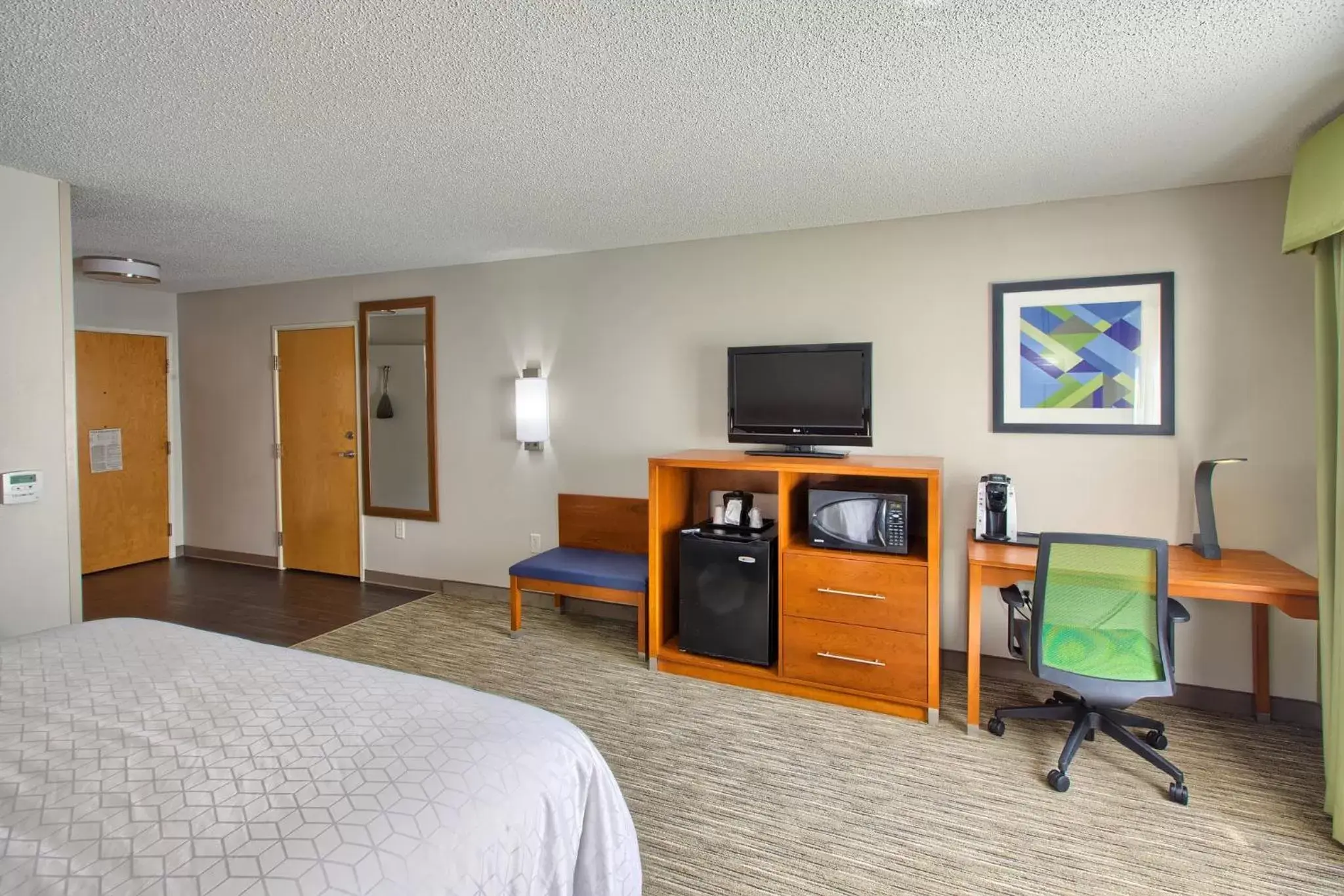 Photo of the whole room, TV/Entertainment Center in Holiday Inn Express Hotel & Suites Raleigh North - Wake Forest, an IHG Hotel