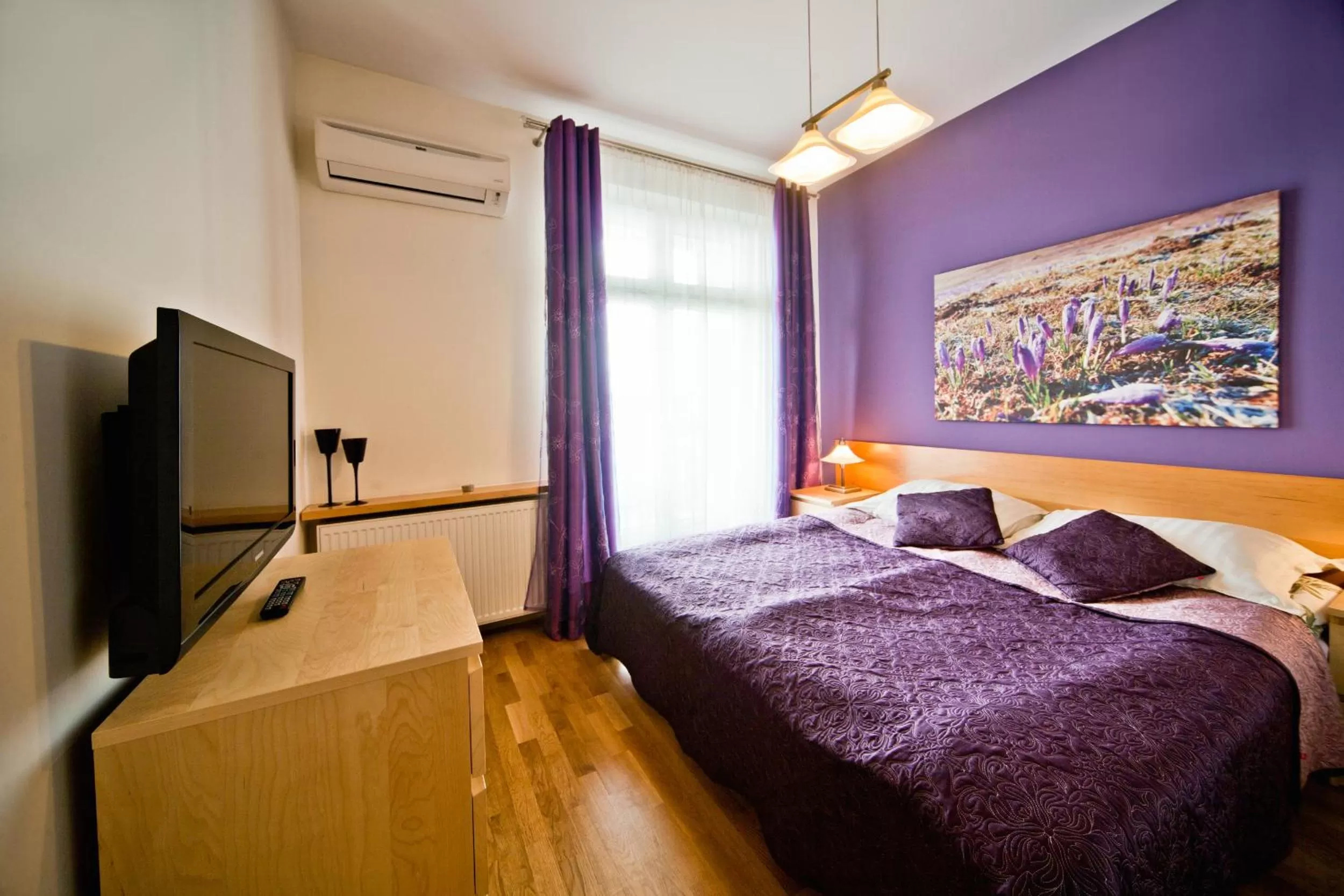 TV and multimedia, Bed in 4Seasons﻿ Apartments Cracow