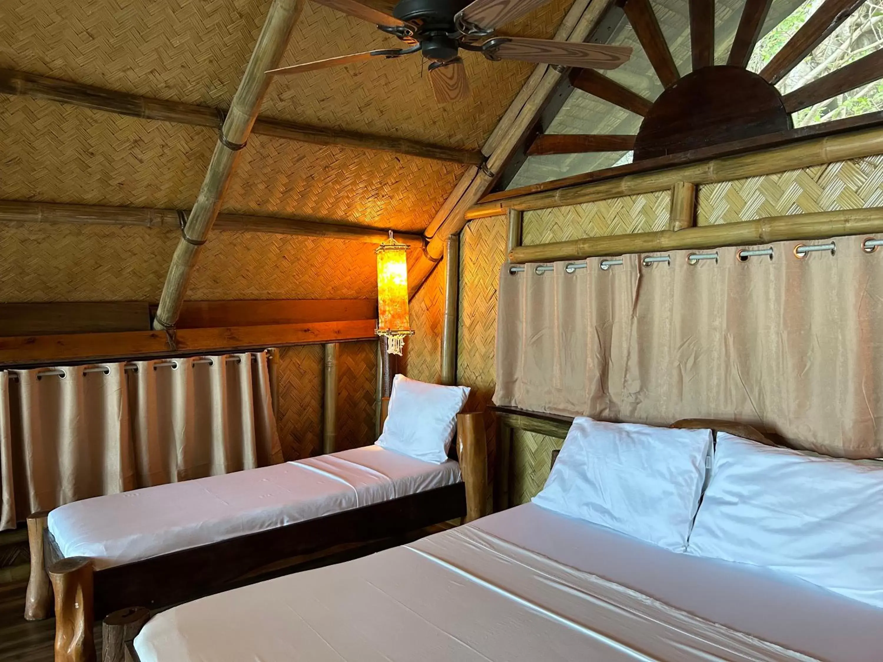 Bed in Sangat Island Dive Resort