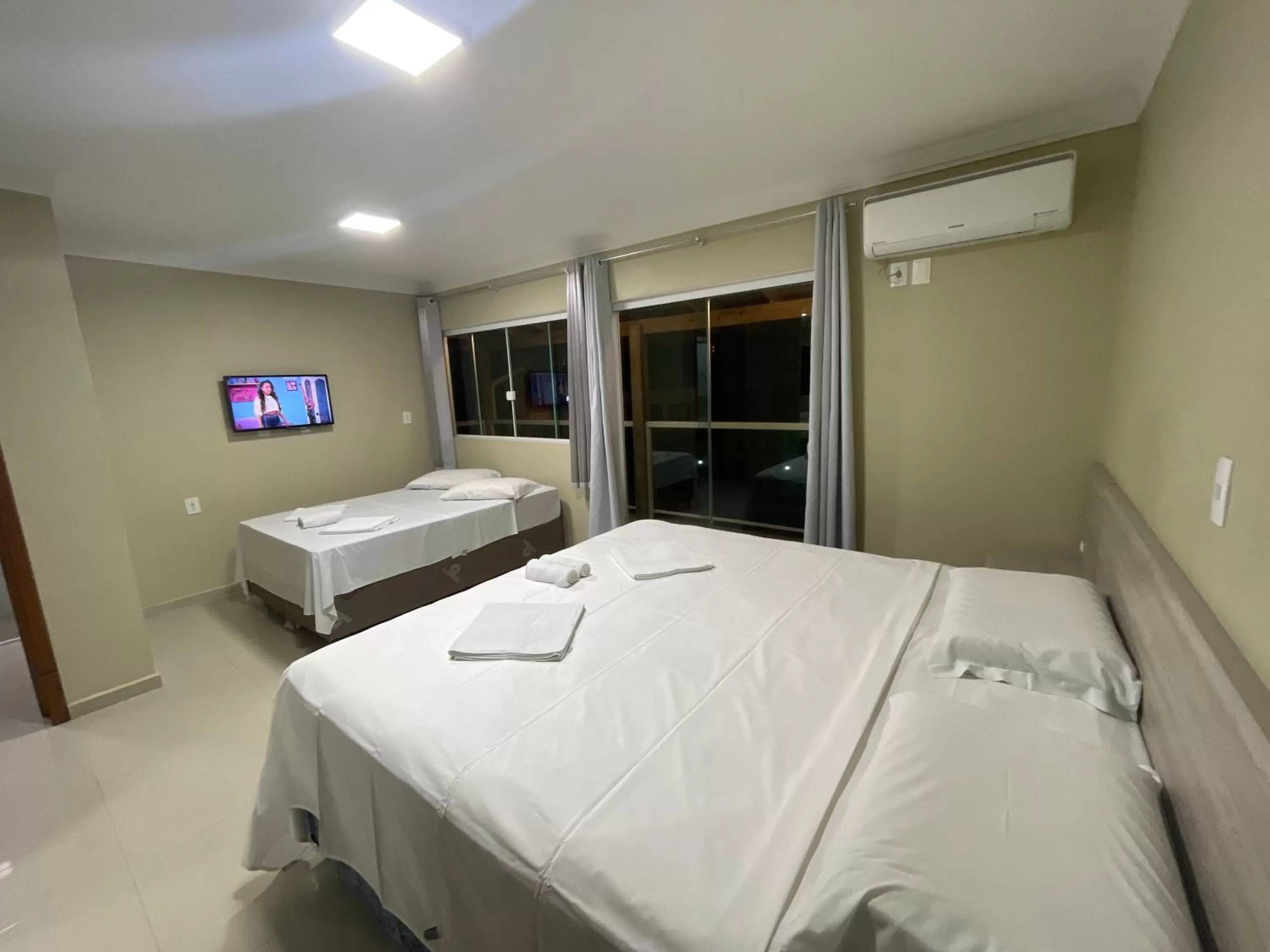 Bed in Pousada Tissiano