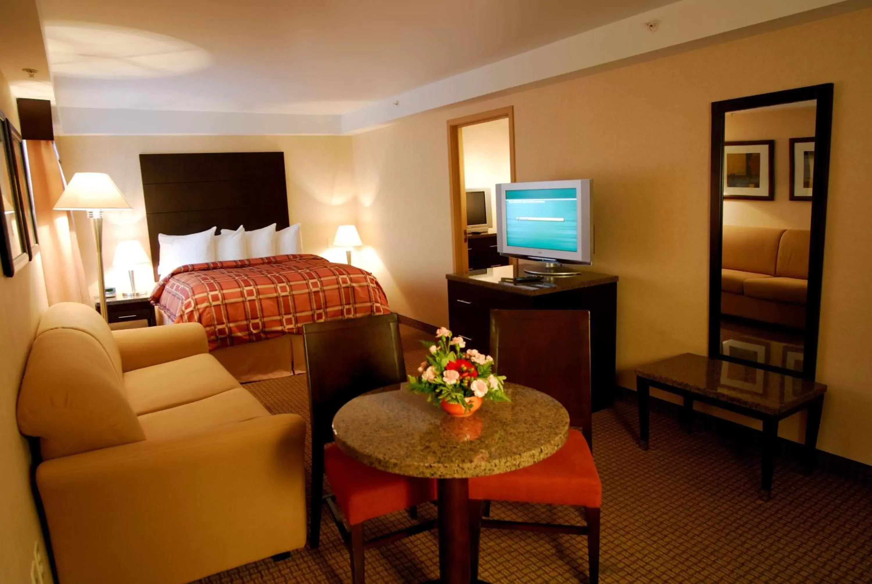 Bedroom, TV/Entertainment Center in Radisson Hotel & Suites Red Deer
