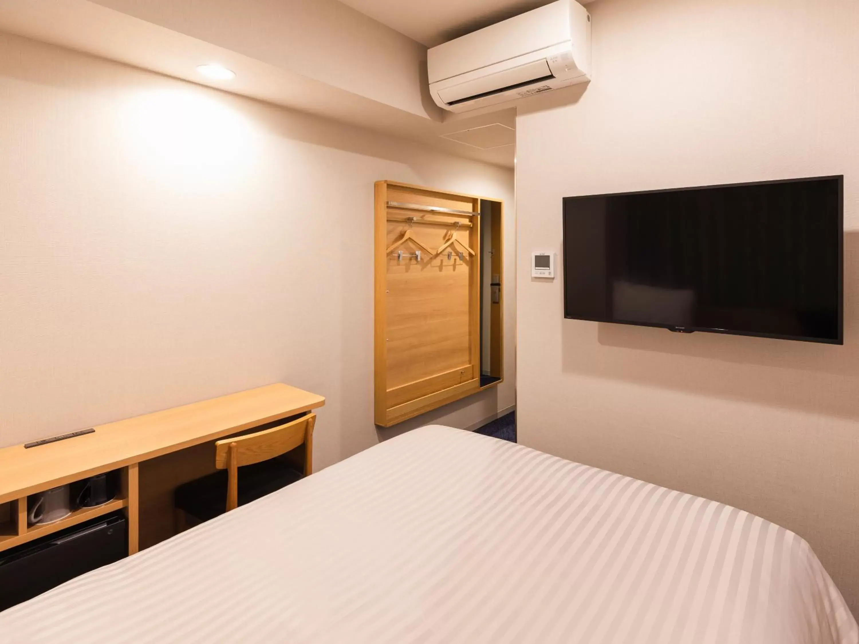 Photo of the whole room, Bed in Sotetsu Fresa Inn Nagoya-Shinkansenguchi