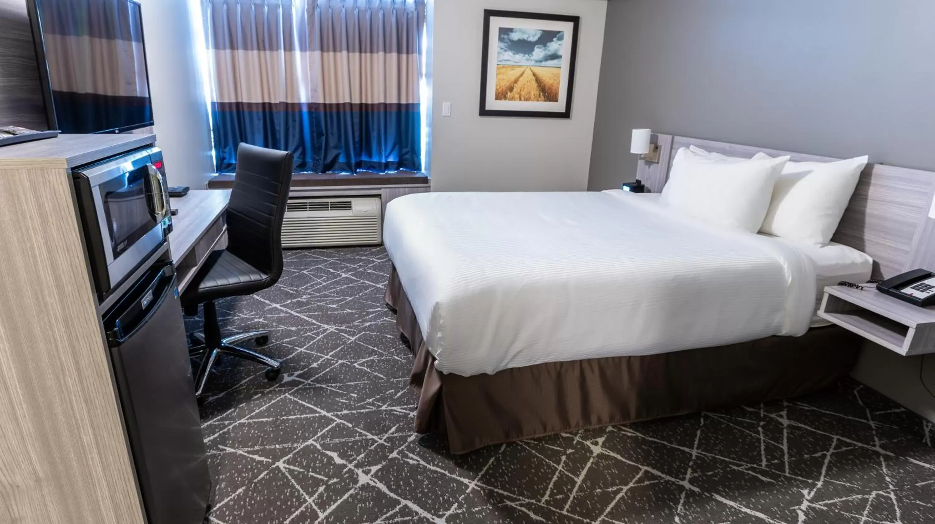 Bed in Microtel Inn & Suites by Wyndham Lloydminster