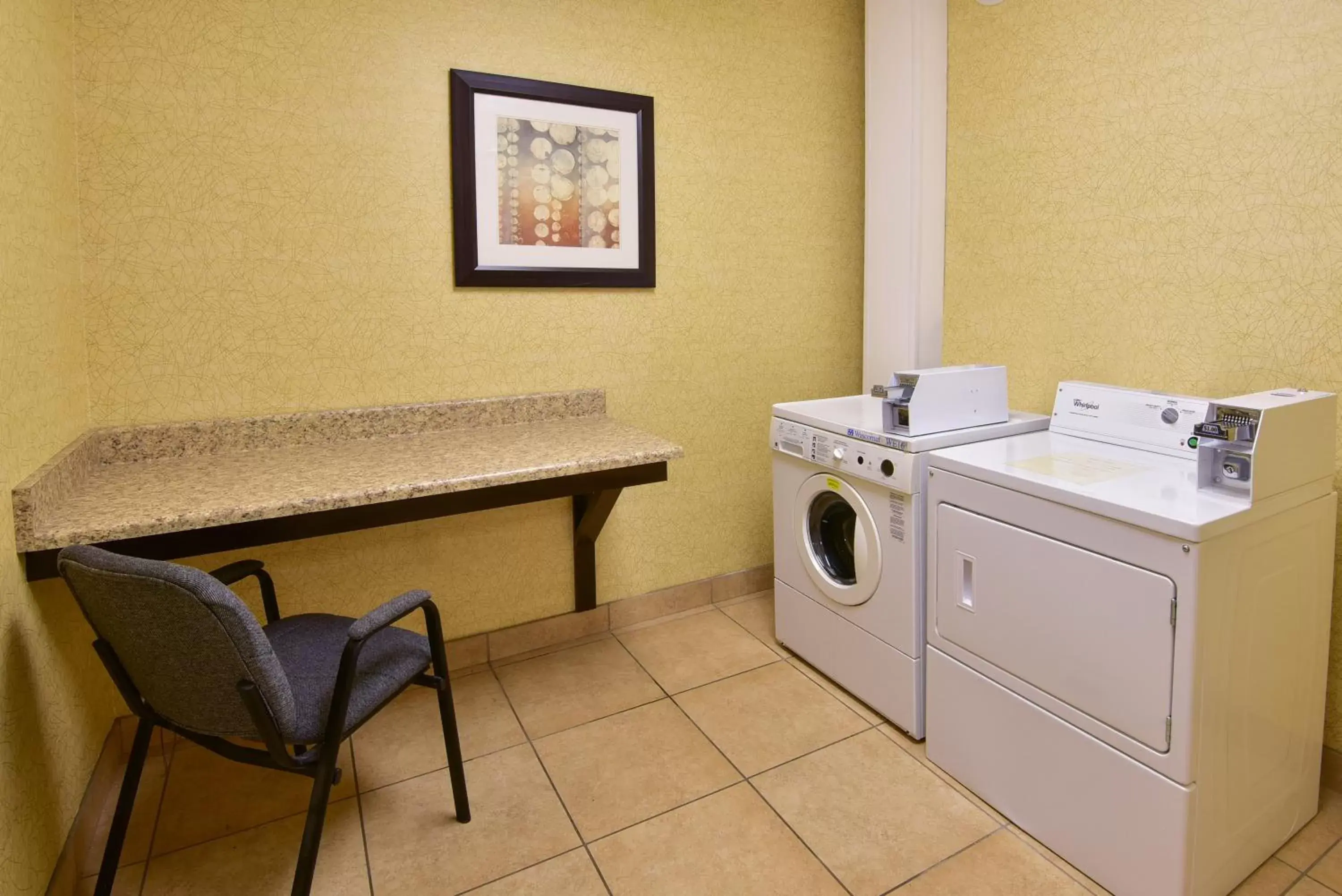 Lobby or reception, Kitchen/Kitchenette in Holiday Inn Express Hotel & Suites Wauseon, an IHG Hotel