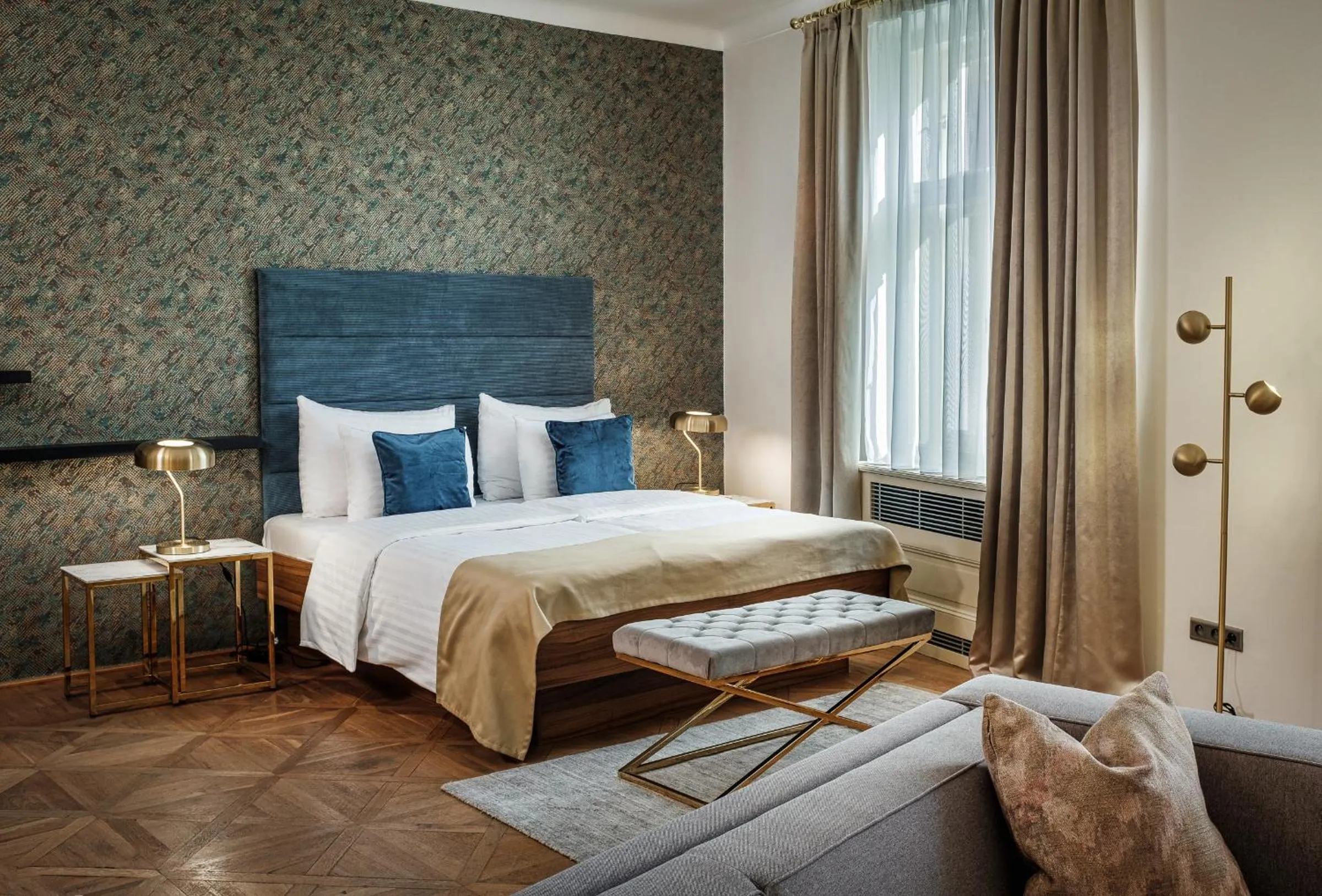 Bed in Golden Angel Suites by Adrez