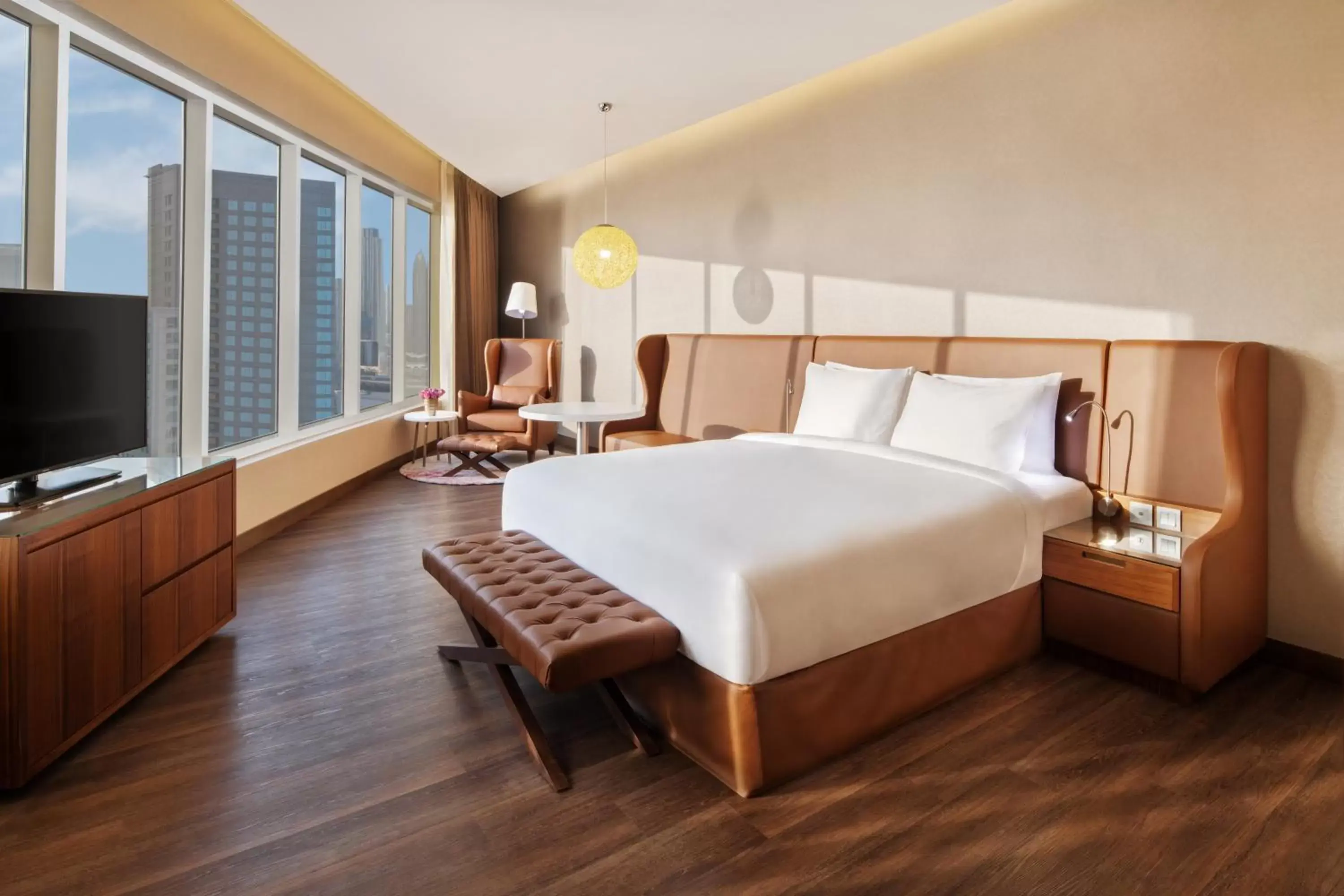Seating area, Bed in Radisson Blu Hotel, Dubai Canal View