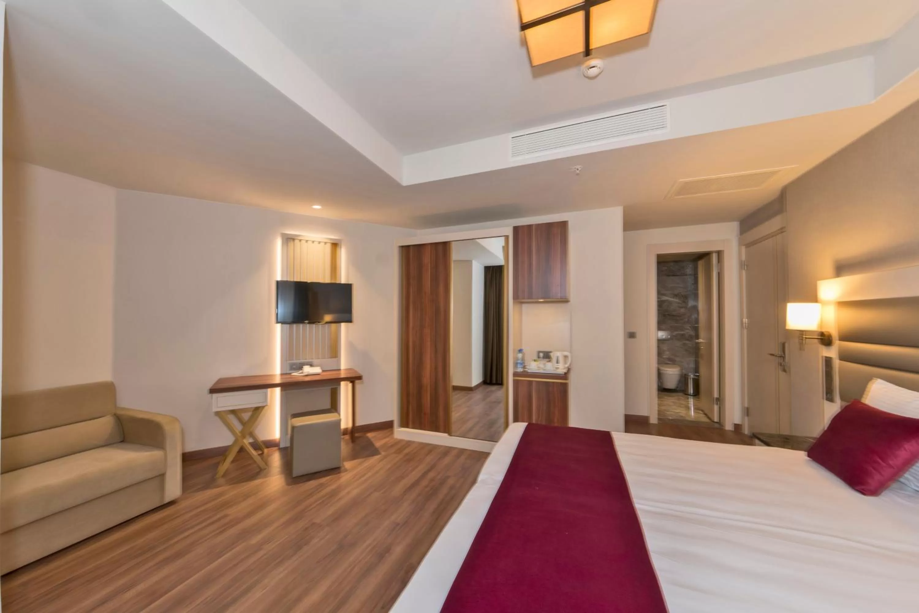 Photo of the whole room, TV/Entertainment Center in Golden Royal Hotel