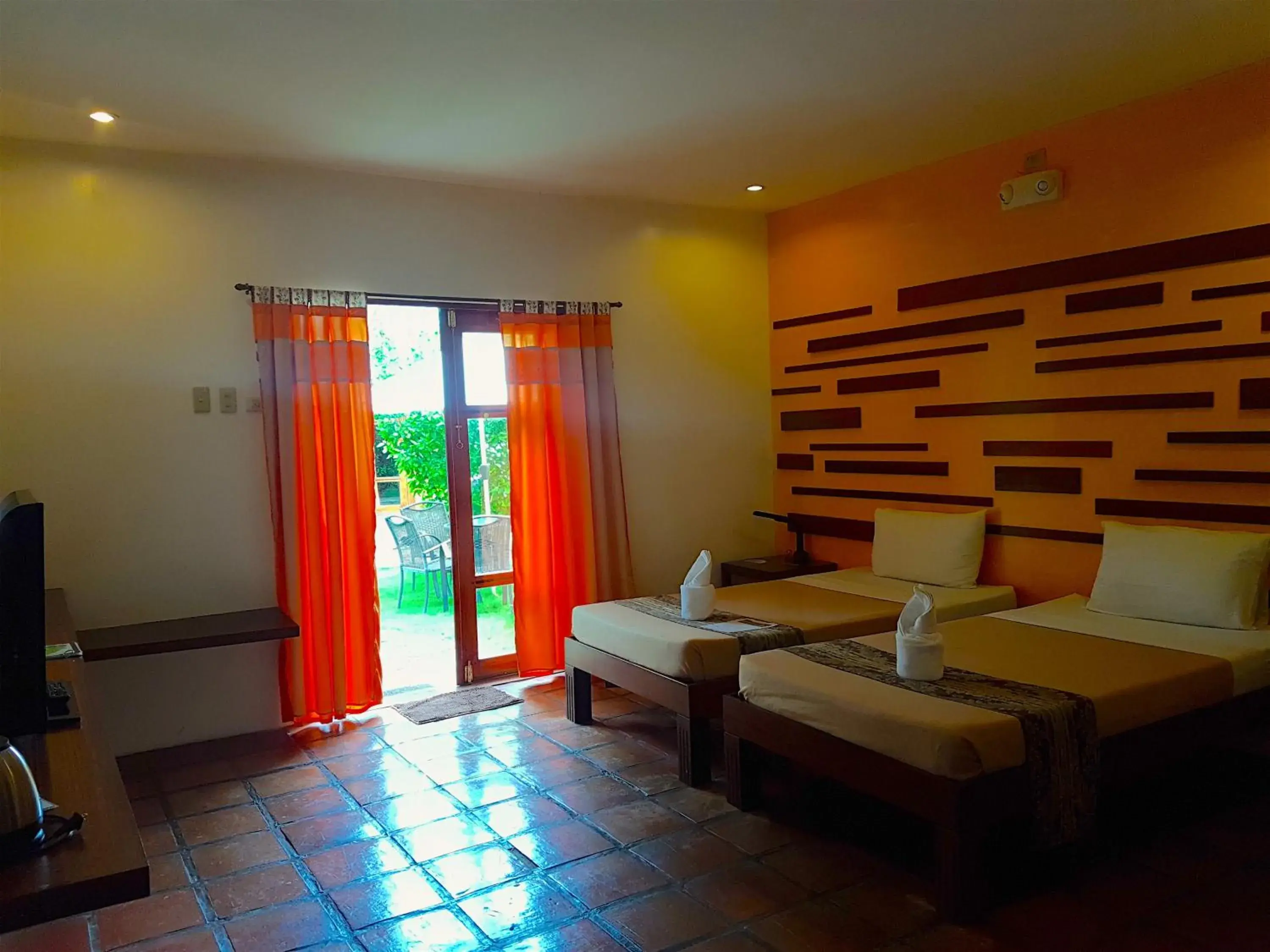 Bed, Seating Area in Acacia Tree Garden Hotel