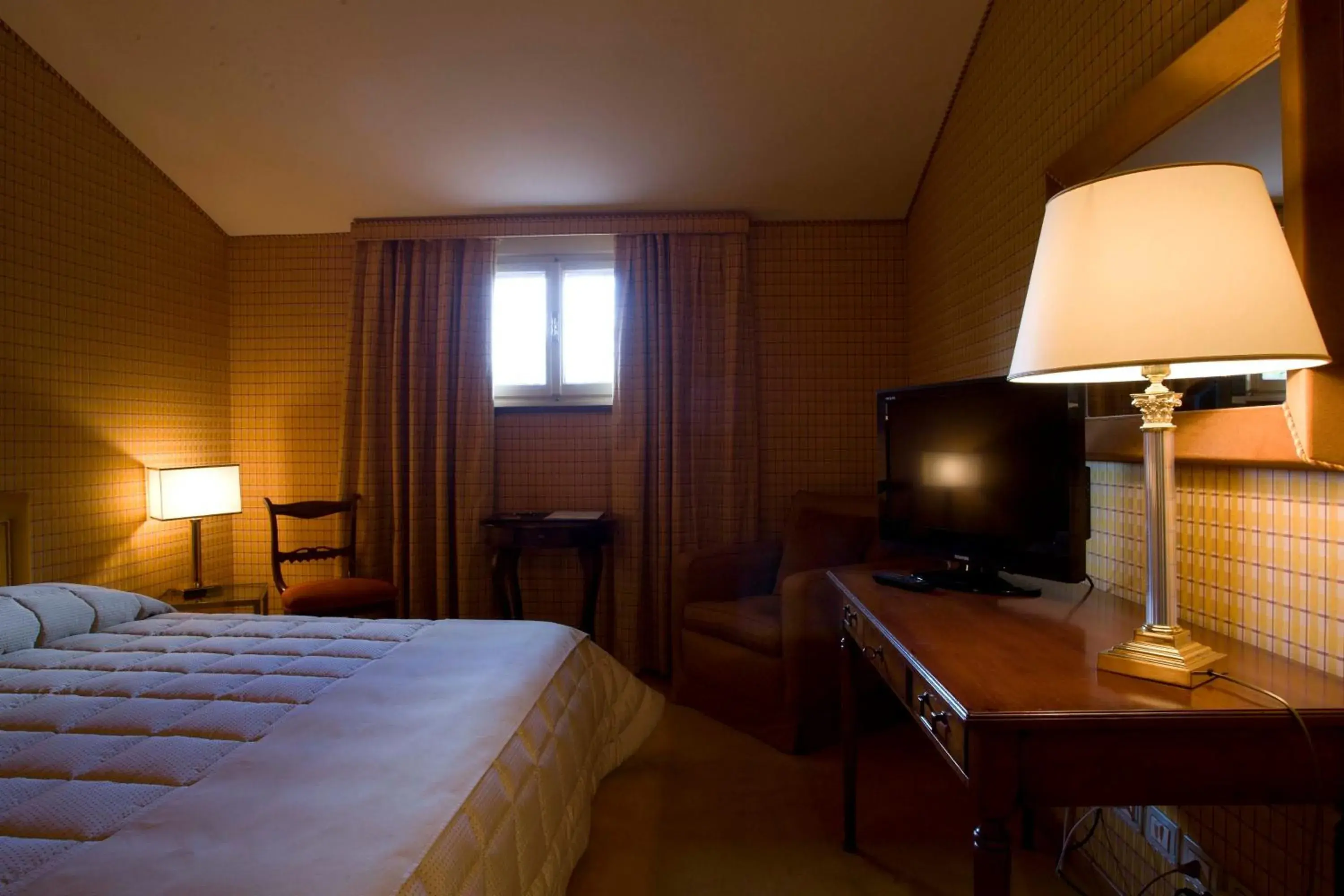Bedroom, TV/Entertainment Center in Hotel Villa La Principessa