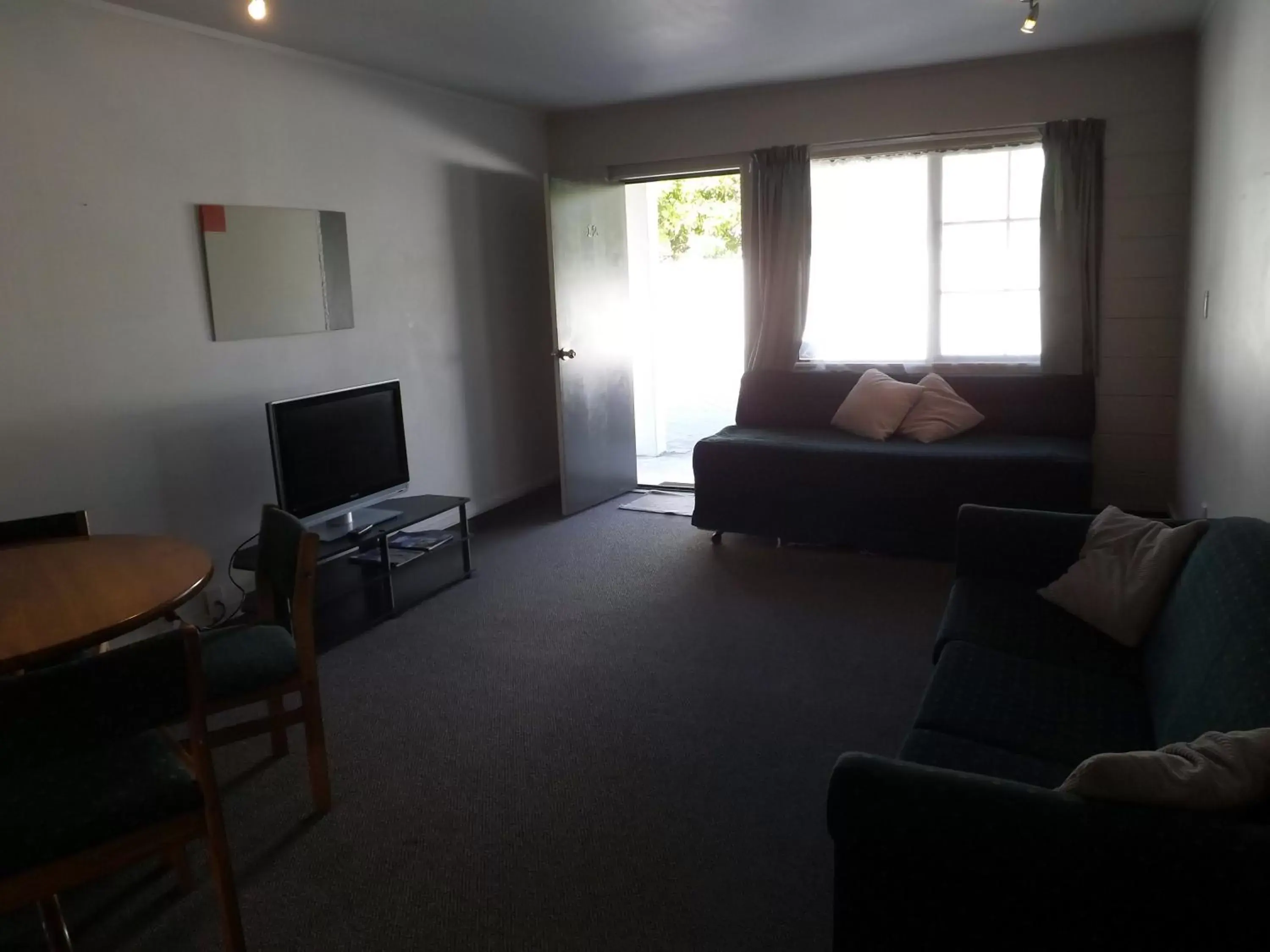 Photo of the whole room, Seating Area in Karaka Tree Motel