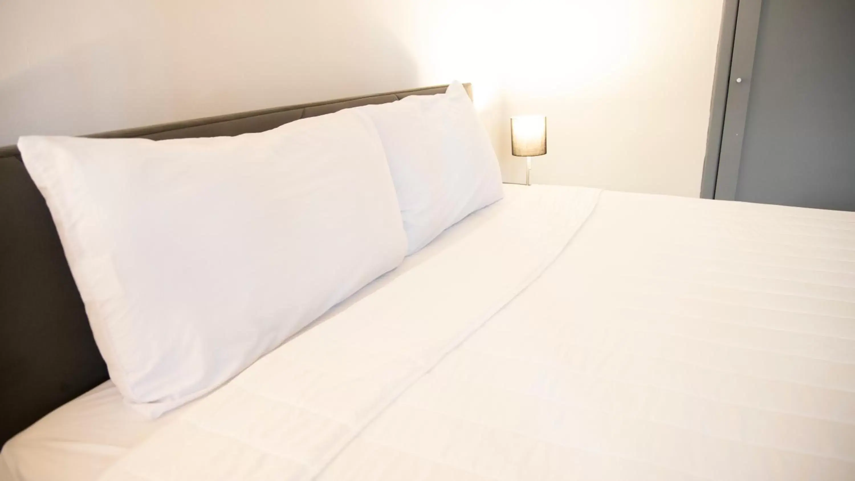 Bed in Hotel Singular Antara