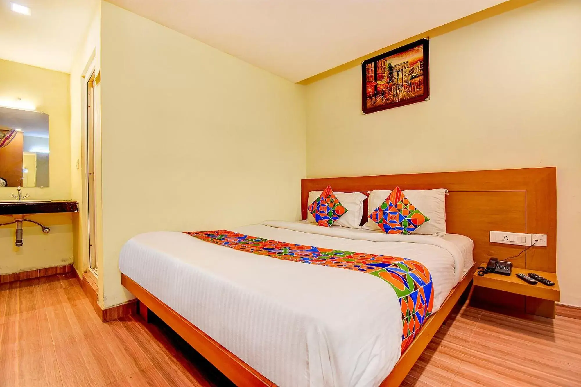 Bed in FabHotel Abirami Grand Inn