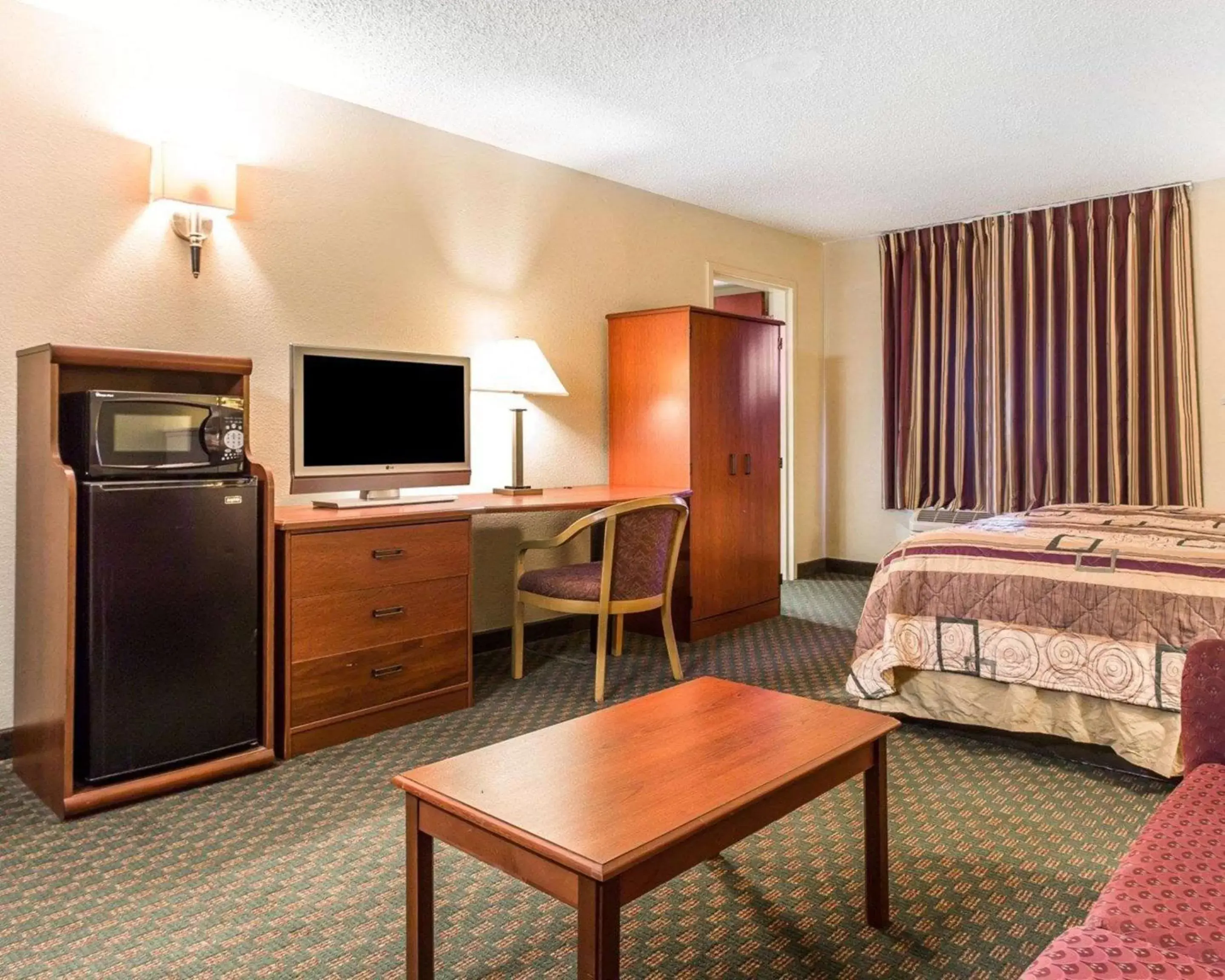 Photo of the whole room, TV/Entertainment Center in Sleep Inn Near Ft. Jackson