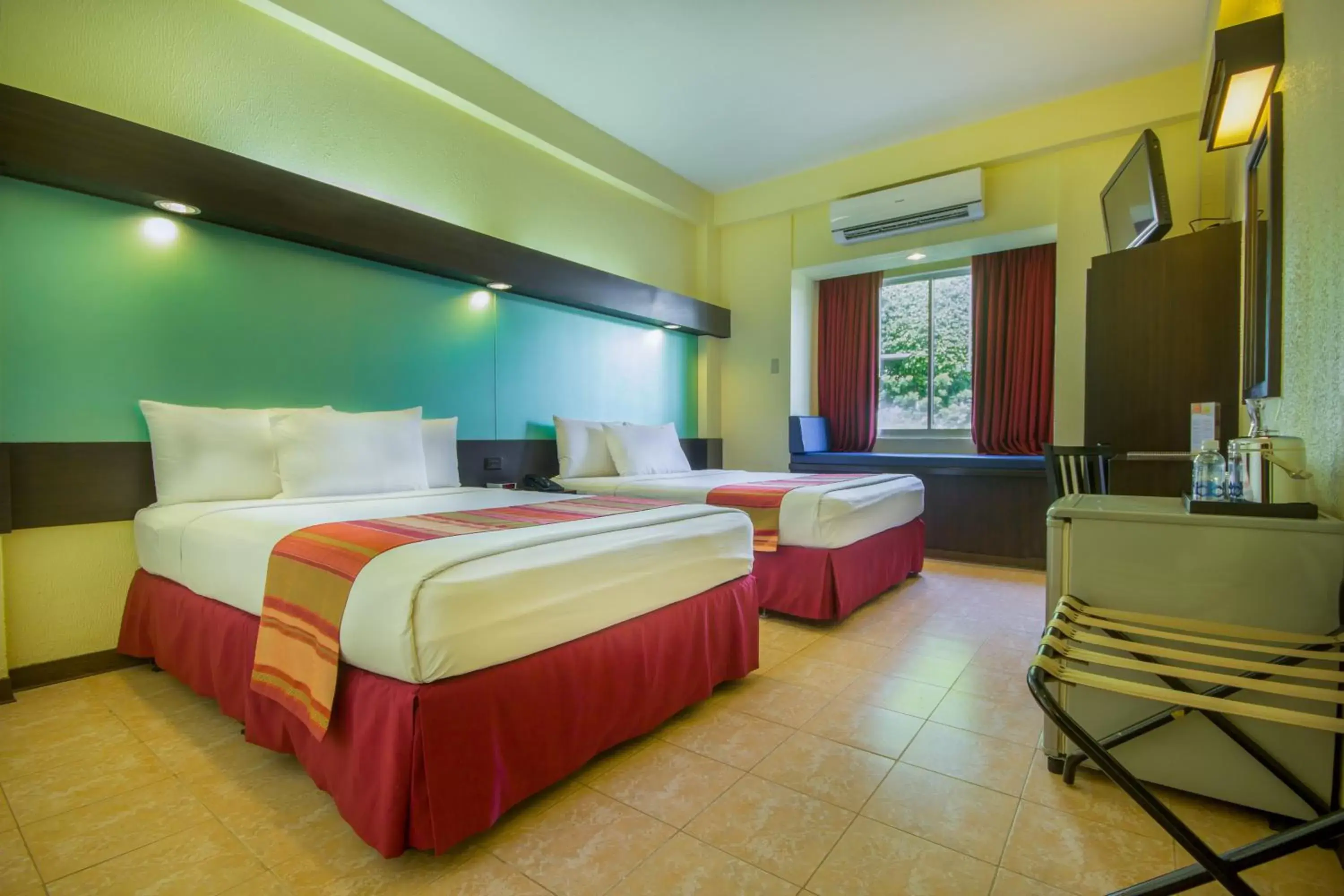 Bed in Microtel by Wyndham Batangas