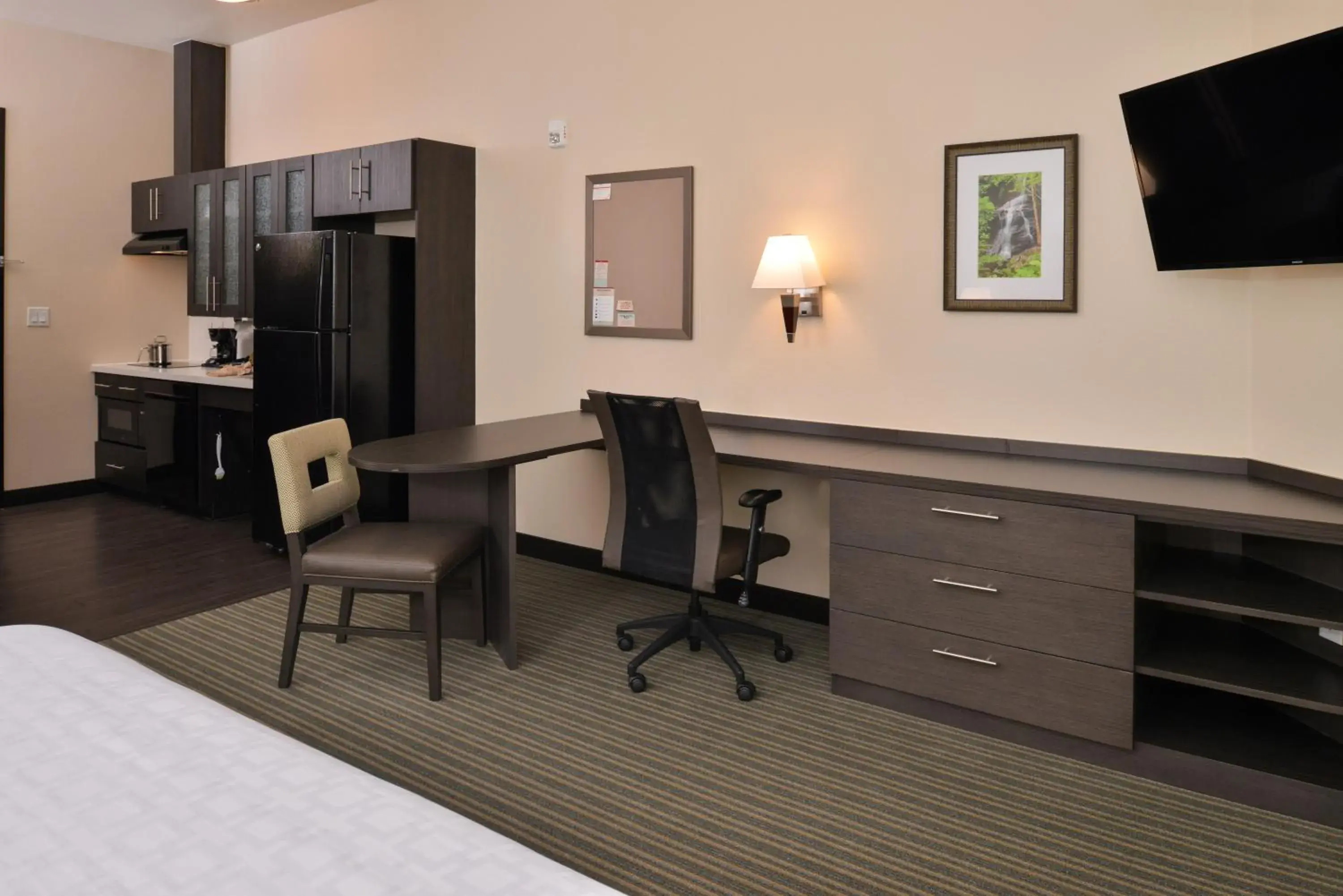 Photo of the whole room, TV/Entertainment Center in Candlewood Suites - Austin Airport, an IHG Hotel