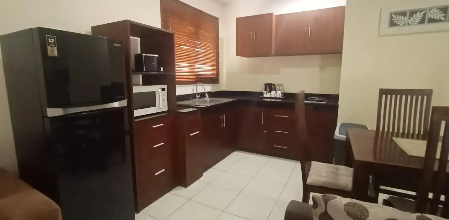 Kitchen/Kitchenette in Sekuta Condo Suites