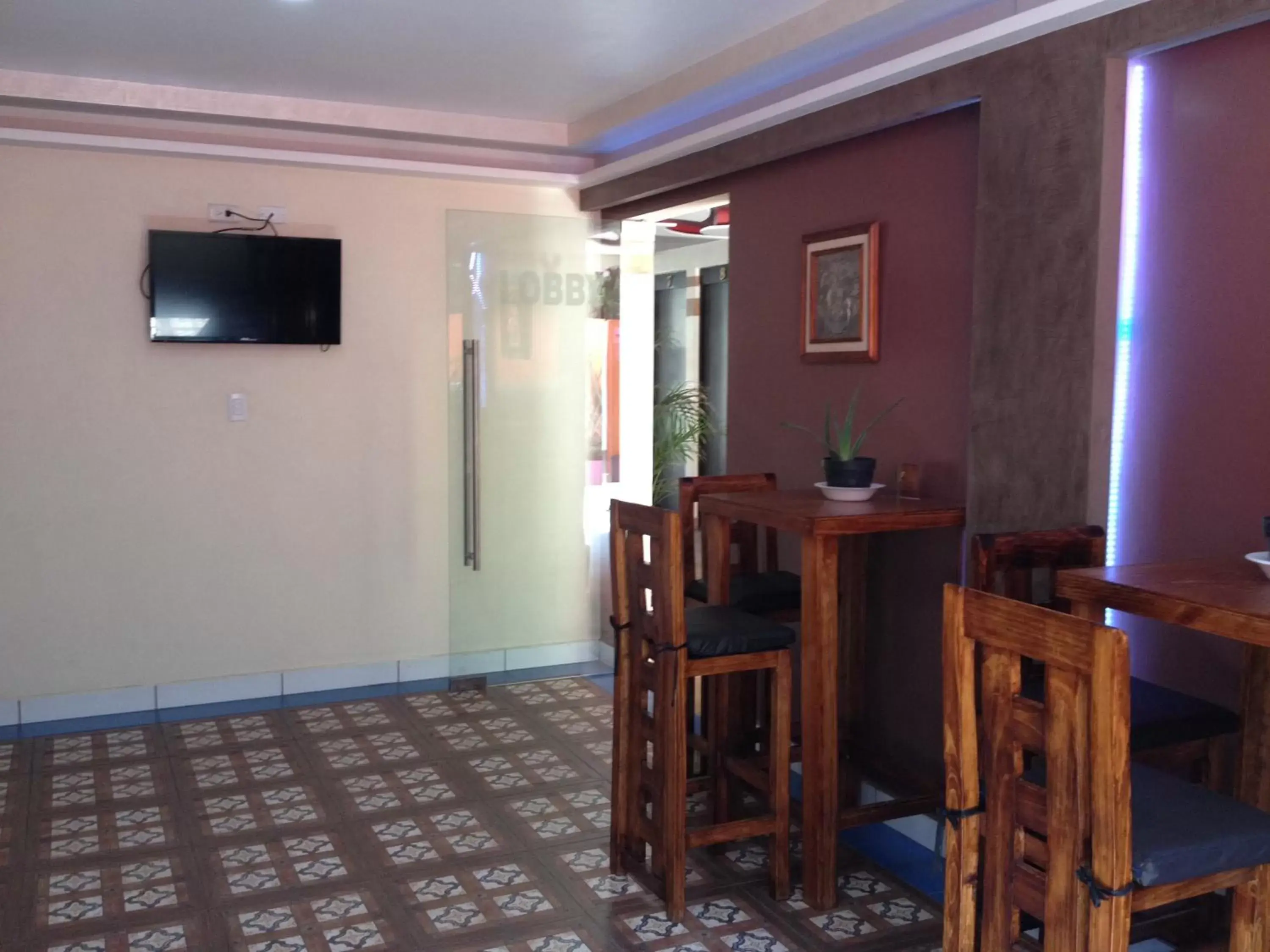 Communal lounge/ TV room, Dining Area in Hotel & Villas 7