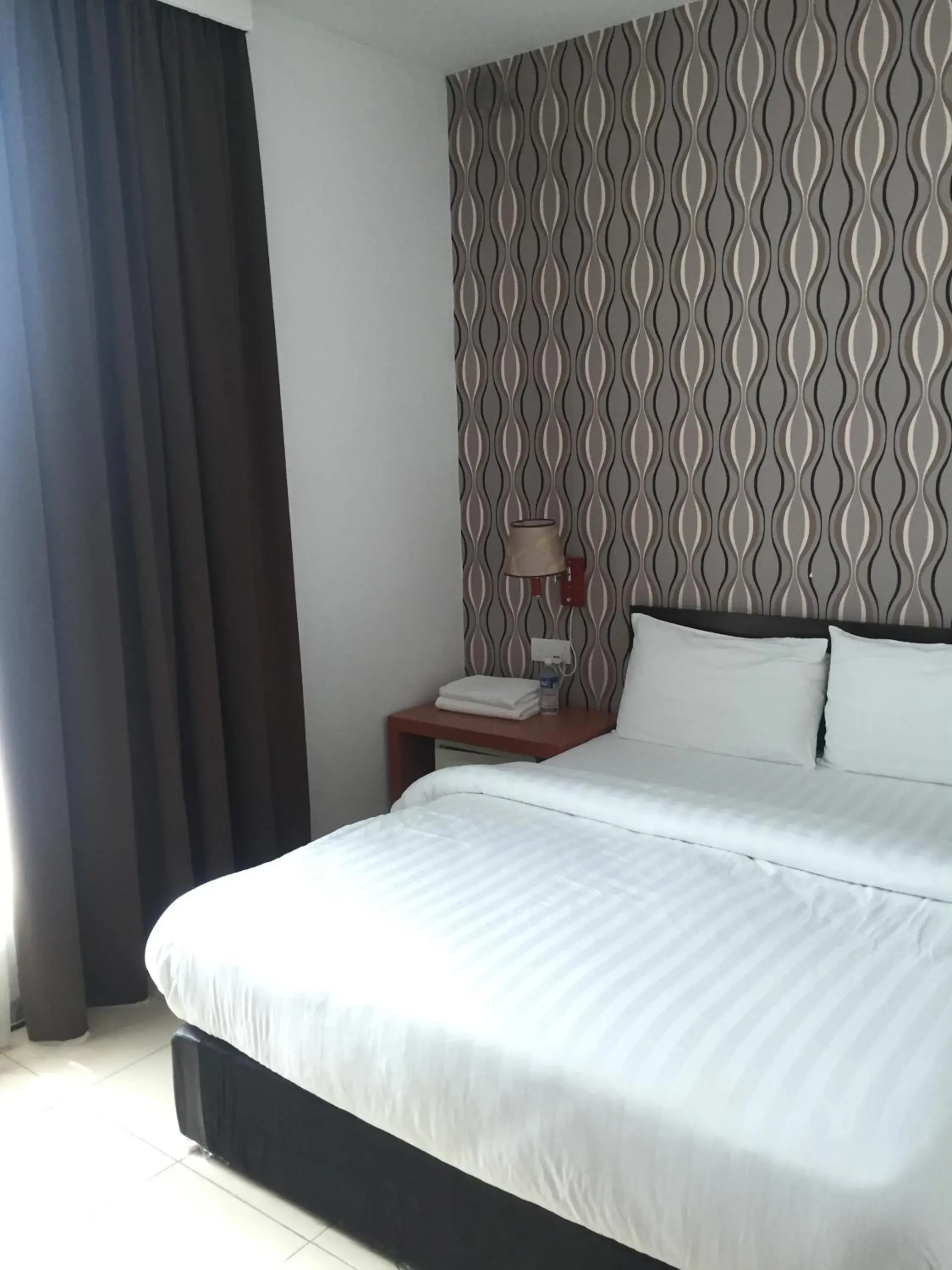 Bed in Permai Hotel