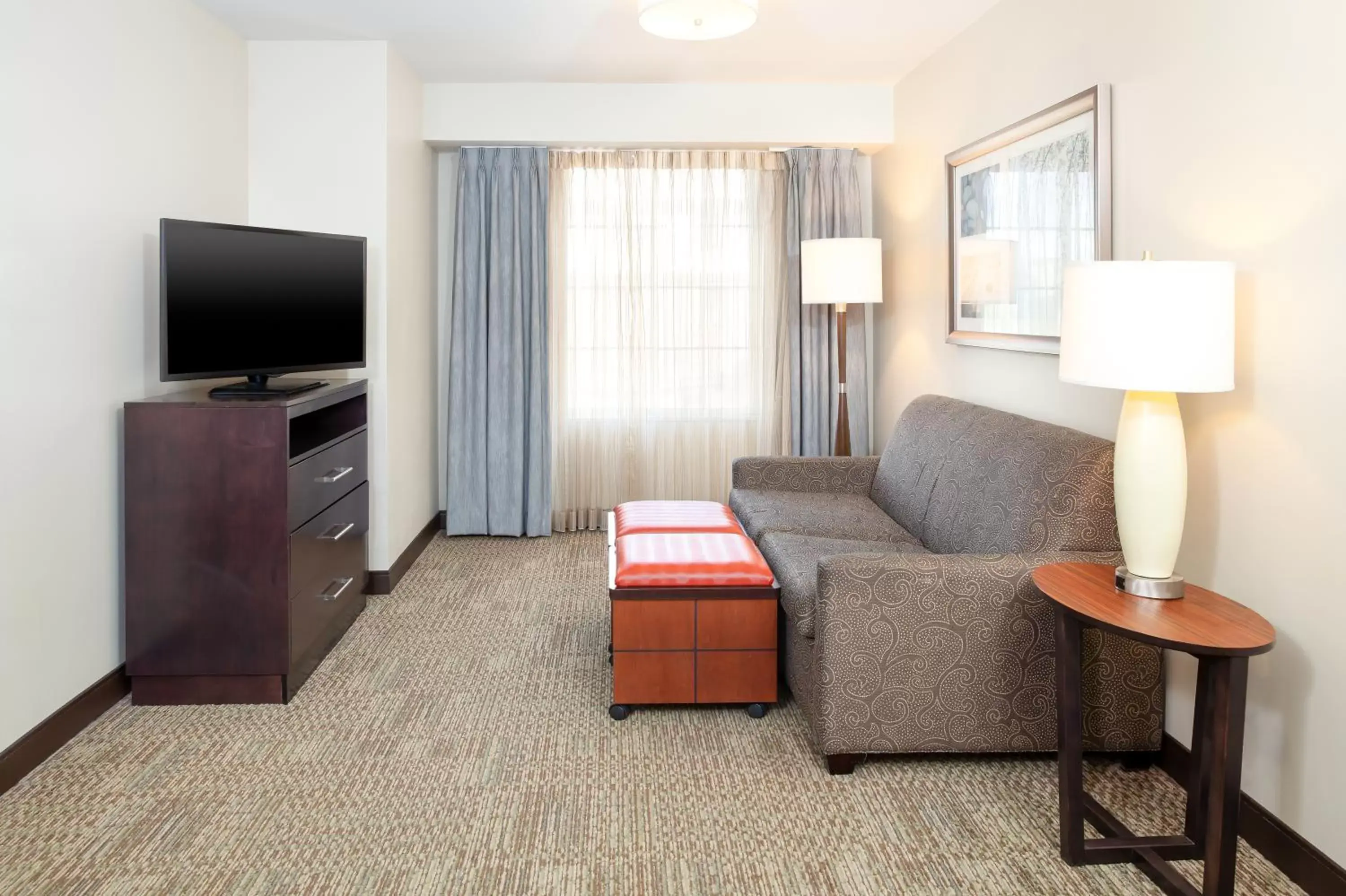 Living room, TV/Entertainment Center in Staybridge Suites Denver - Central Park, an IHG Hotel