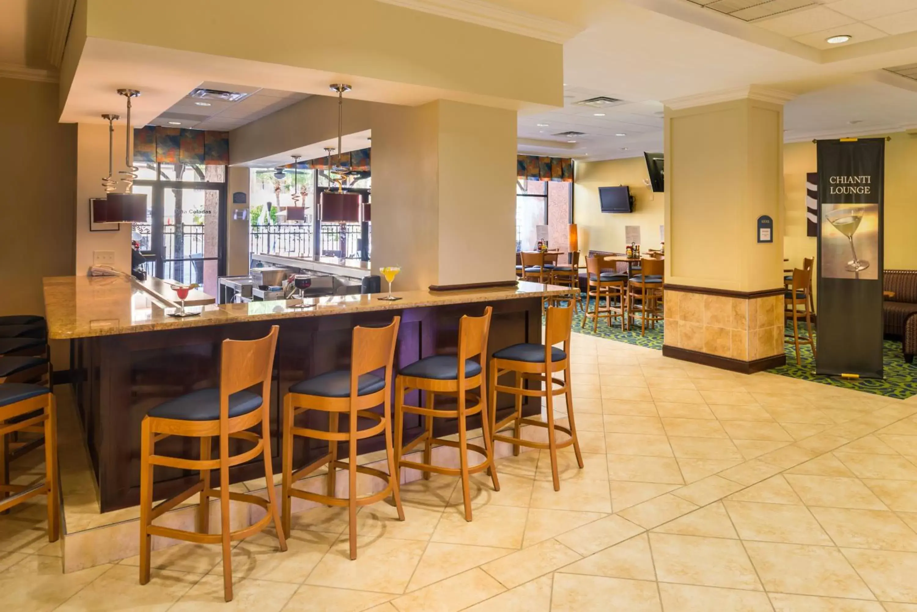 Lounge or bar, Lounge/Bar in Holiday Inn & Suites Orlando SW - Celebration Area, an IHG Hotel