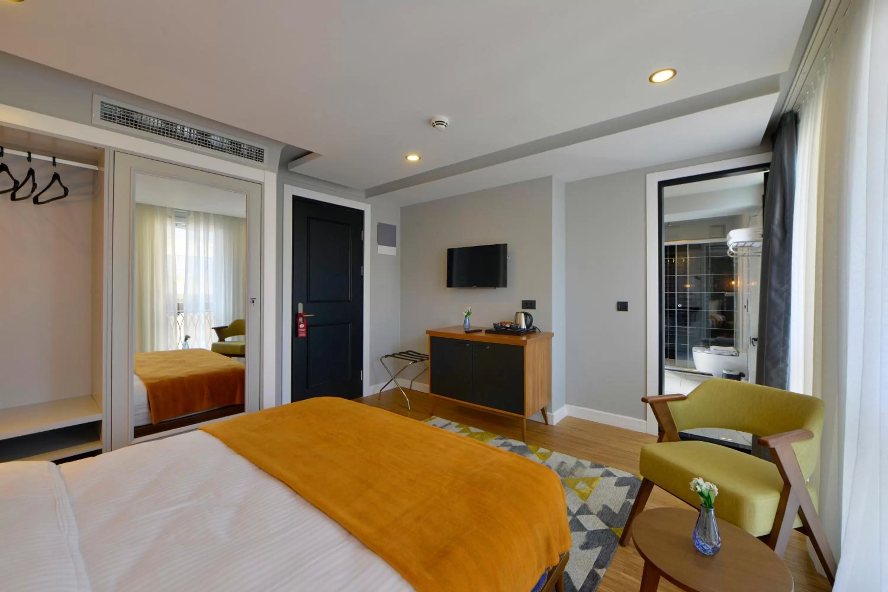 Photo of the whole room, Bed in Hotel Poem